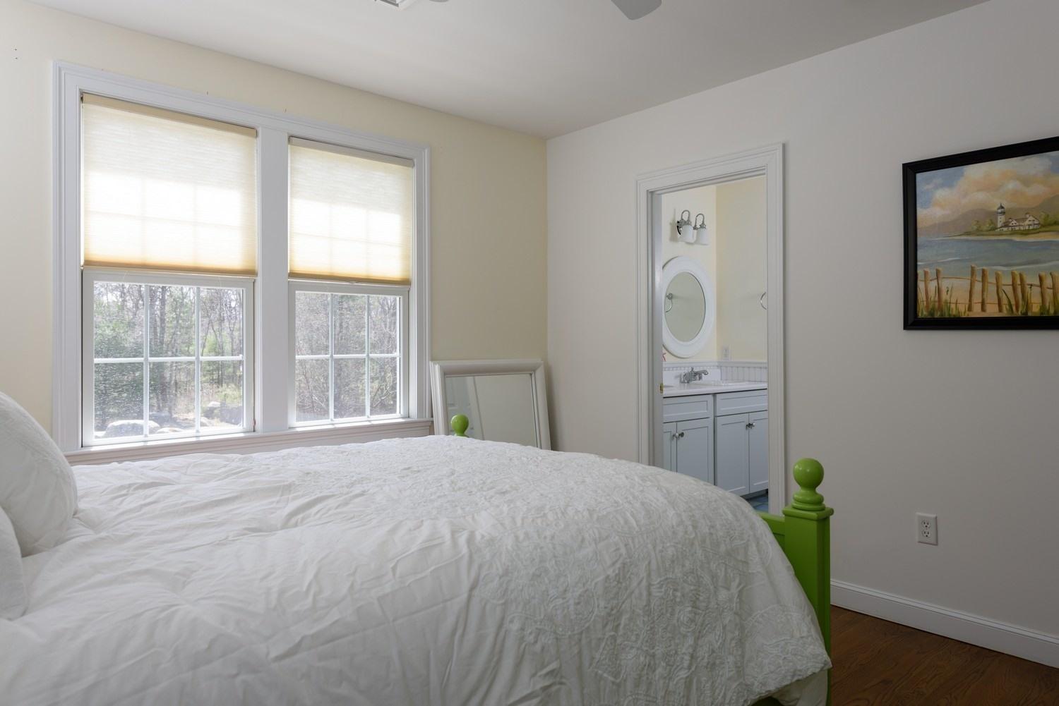425 Scraggy Neck Road Cataumet, MA 02534 - Photo 17 of 32 a bedroom with a bed and a window