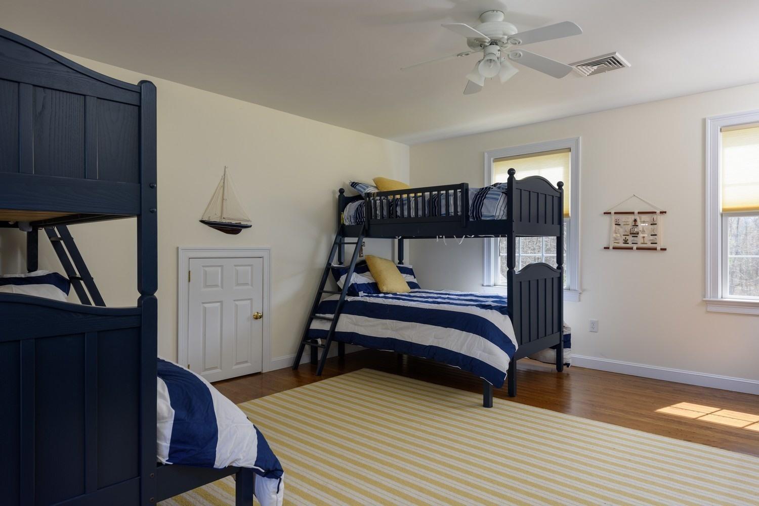 425 Scraggy Neck Road Cataumet, MA 02534 - Photo 19 of 32 a bedroom with furniture and a window