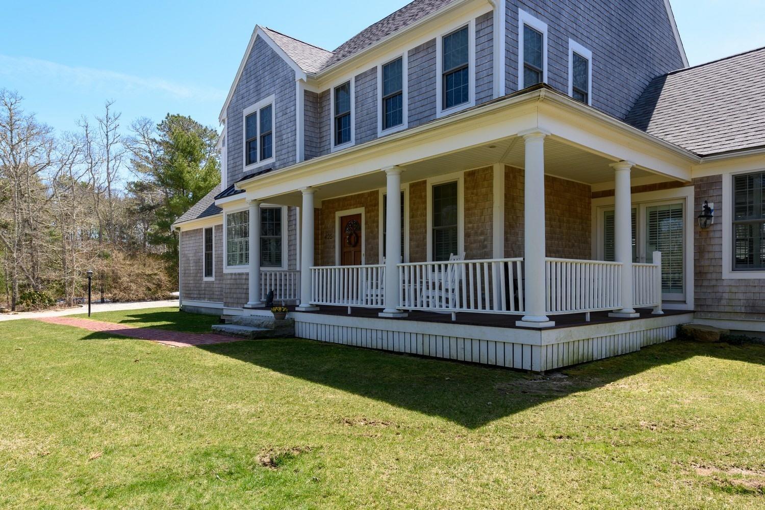 425 Scraggy Neck Road Cataumet, MA 02534 - Photo 4 of 32 front view of a house with a yard