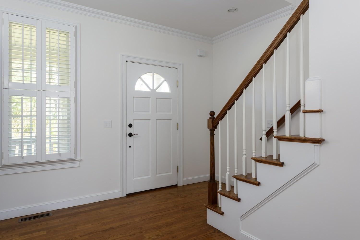 425 Scraggy Neck Road Cataumet, MA 02534 - Photo 5 of 32 a view of entryway with wooden floor and stairs