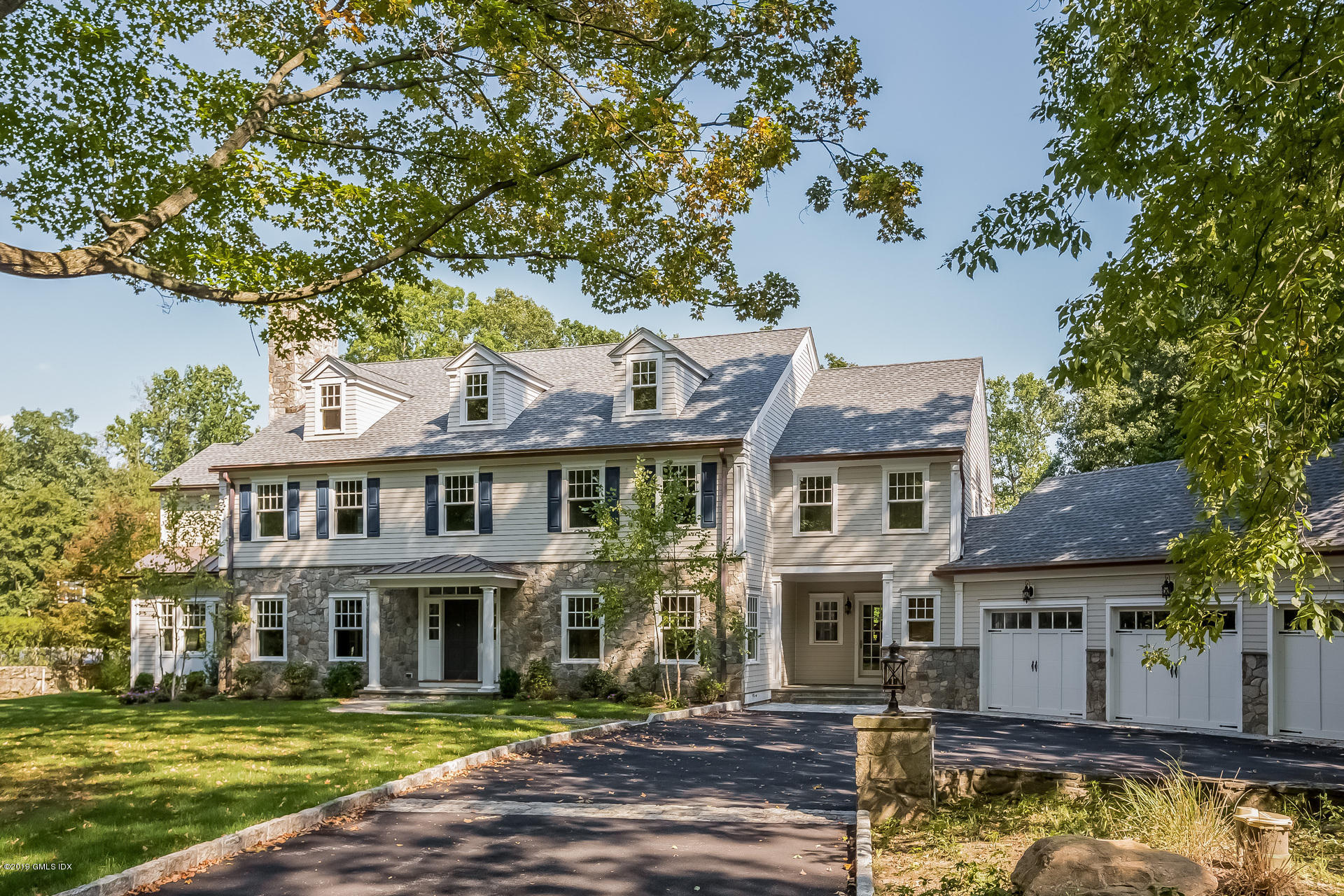 15 Cottontail Road Cos Cob, CT 06807 - Photo 1 of 13 front view of a building with a garden