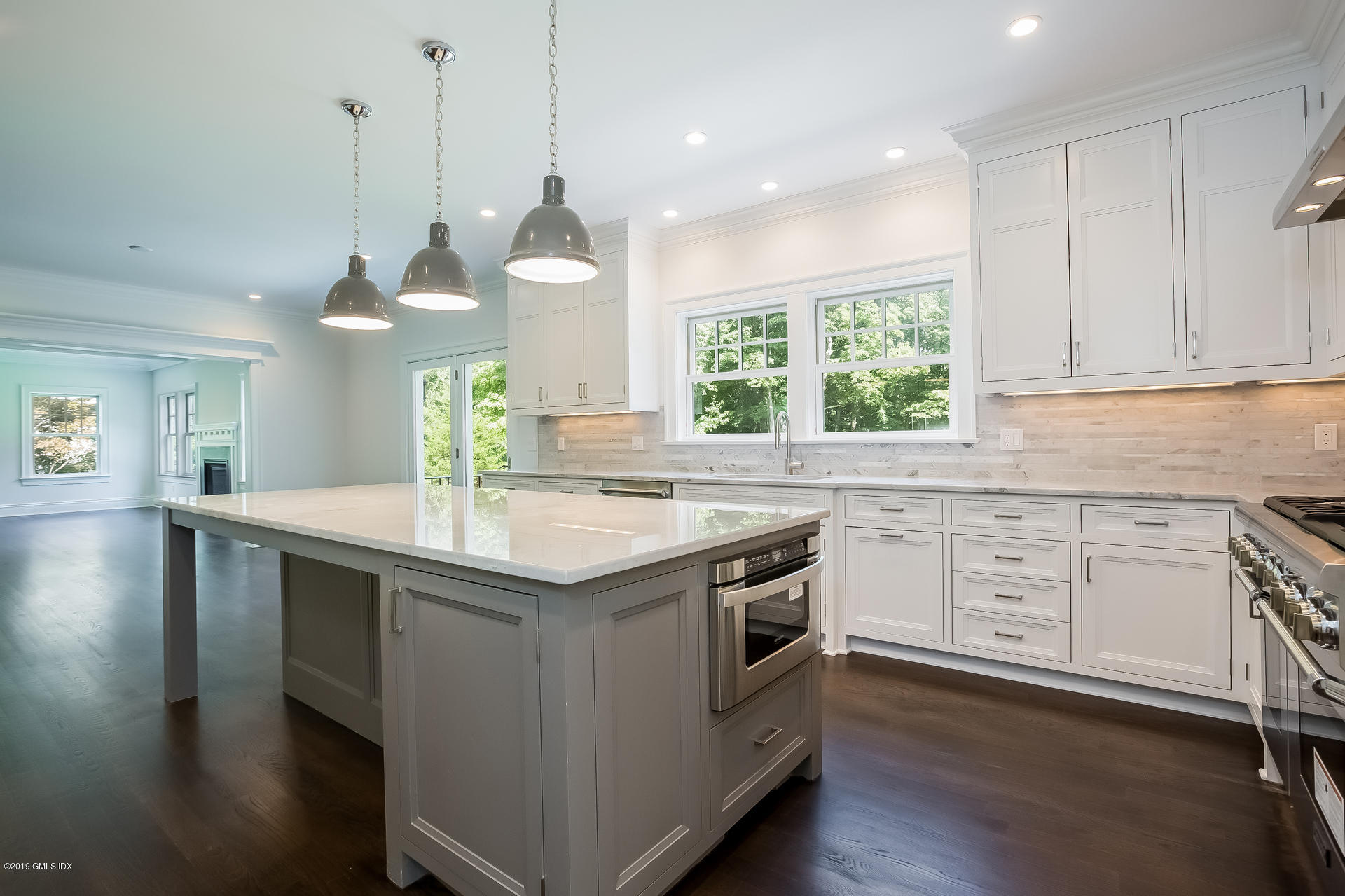 15 Cottontail Road Cos Cob, CT 06807 - Photo 5 of 13 a kitchen with a stove a sink and windows