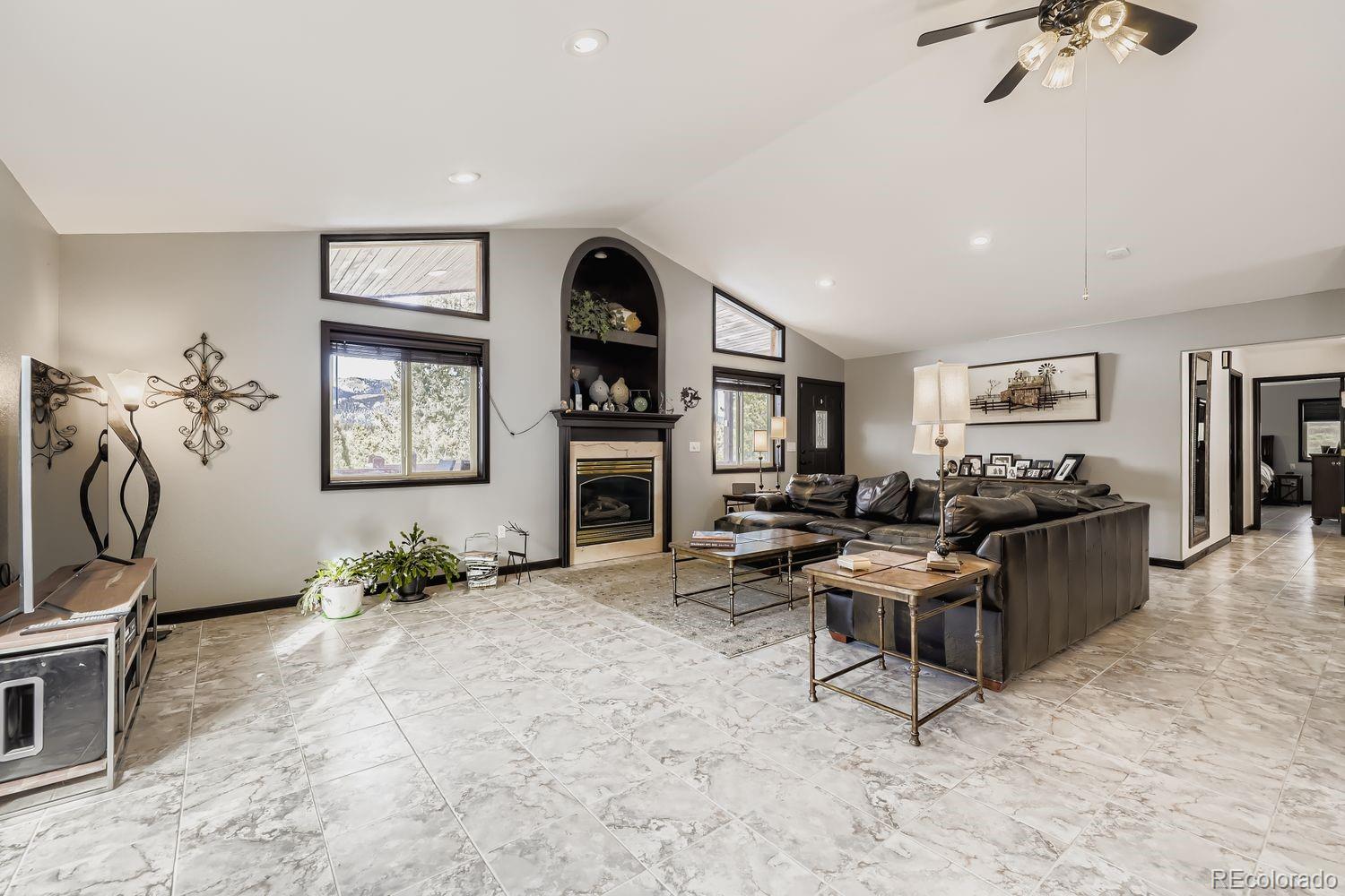296 Desperado Road Bailey, CO 80421 - Photo 16 of 37 a living room with furniture and a window