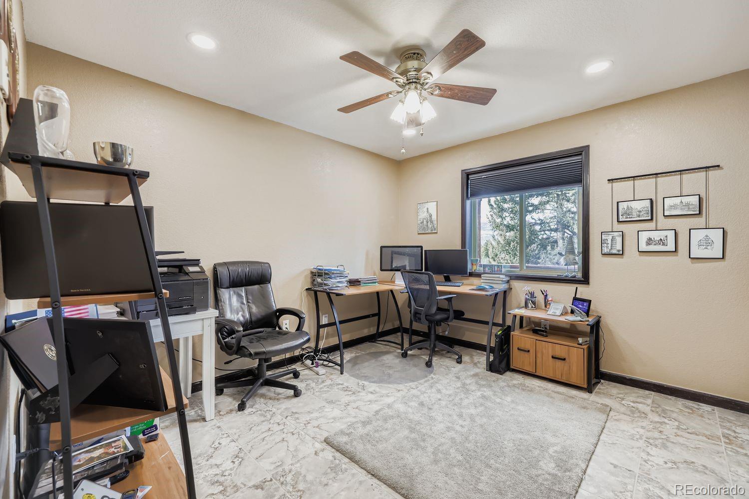 296 Desperado Road Bailey, CO 80421 - Photo 17 of 38 a workspace with a window