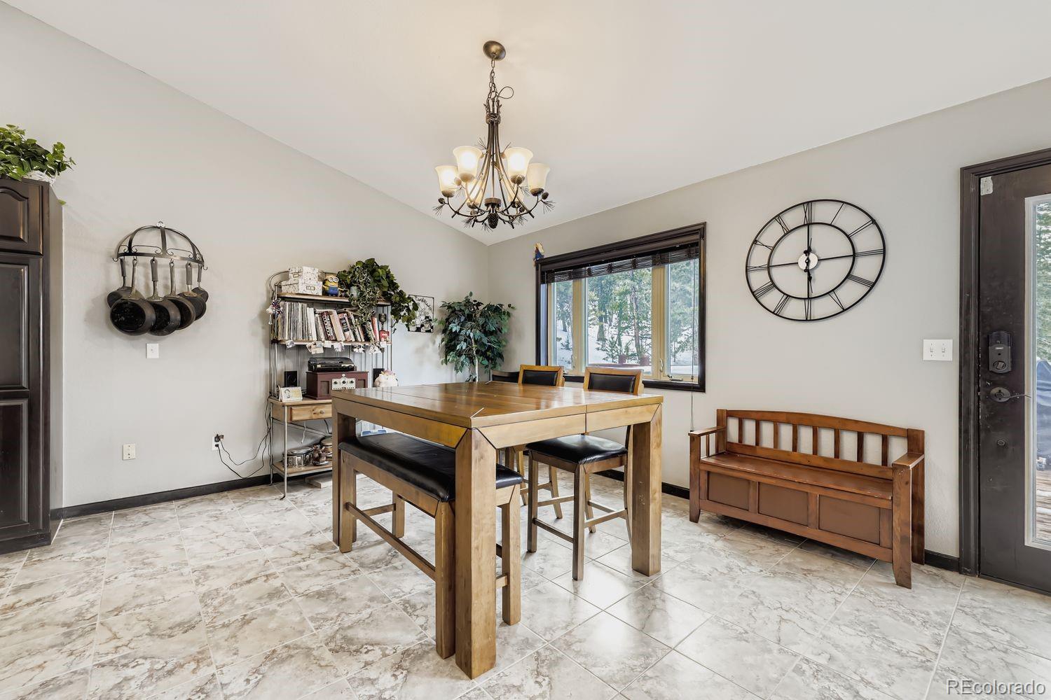 296 Desperado Road Bailey, CO 80421 - Photo 18 of 38 a view of a room with furniture window and wooden floor