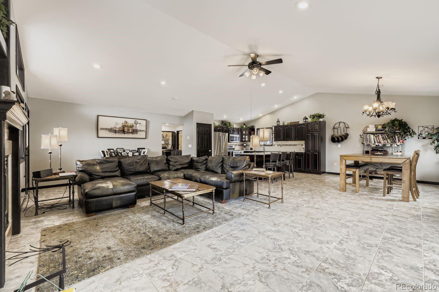 296 Desperado Road Bailey, CO 80421 - Photo 20 of 38 a living room with furniture and a chandelier