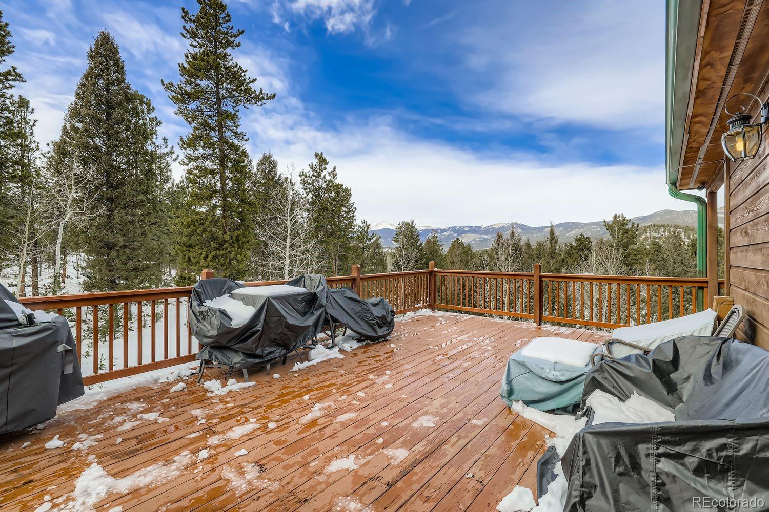 296 Desperado Road Bailey, CO 80421 - Photo 30 of 38 a view of a roof deck with couches