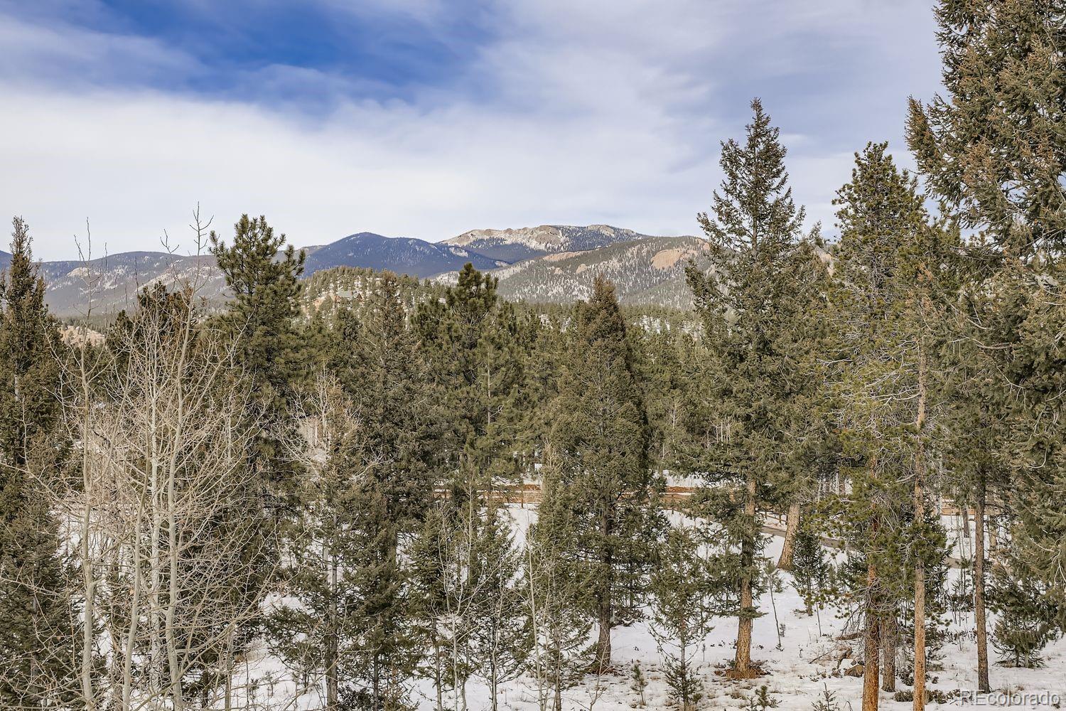 296 Desperado Road Bailey, CO 80421 - Photo 36 of 37 a view of a city with a mountain in the background