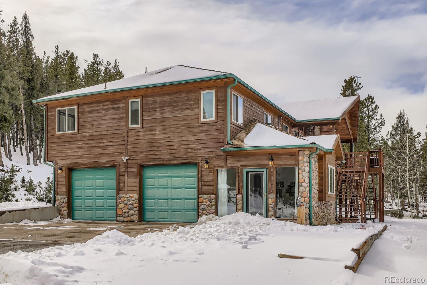 296 Desperado Road Bailey, CO 80421 - Photo 38 of 38 a front view of a house with a yard