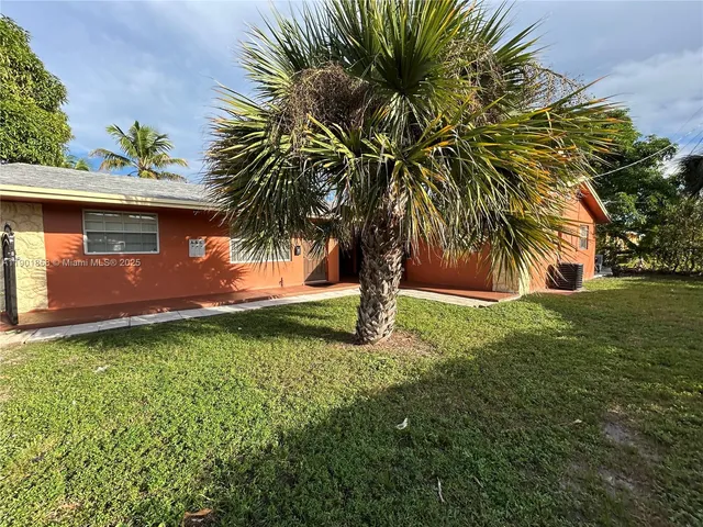 a view of a backyard with a garden