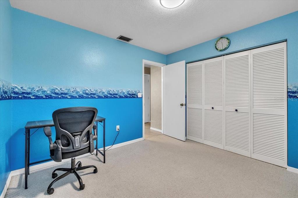 25313 Durango Court Punta Gorda, FL 33955 - Photo 18 of 34 a view of a workspace with furniture and a window