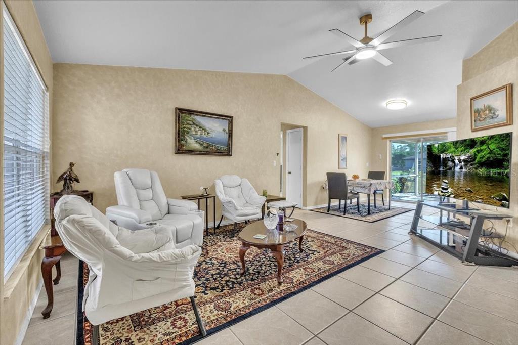25313 Durango Court Punta Gorda, FL 33955 - Photo 2 of 34 a living room with furniture and a large window