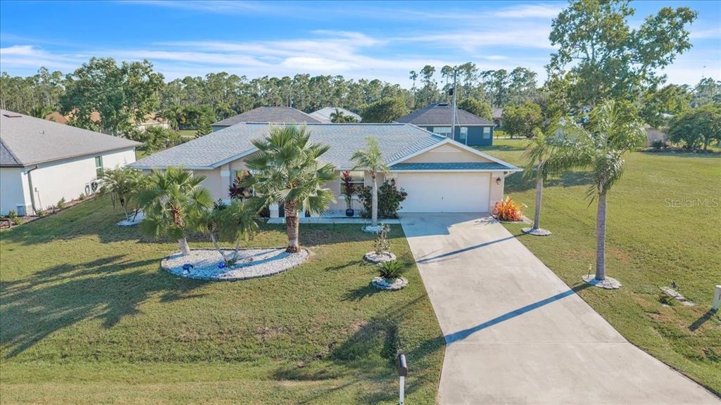 25313 Durango Court Punta Gorda, FL 33955 - Photo 34 of 34 a view of a house with a yard