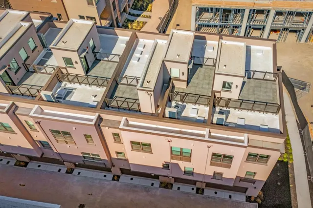 a bathroom with a sink toilet vanity and shower