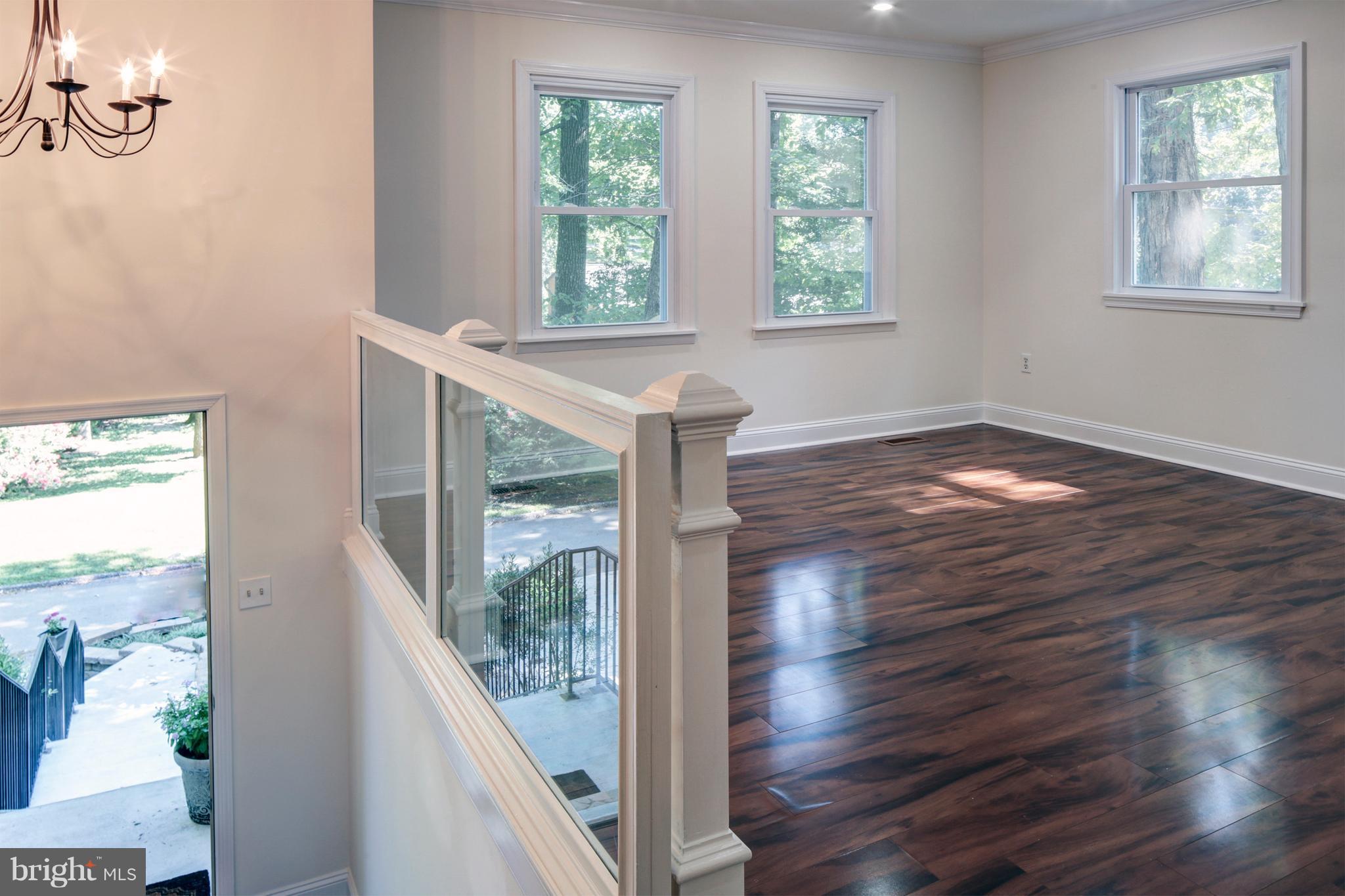 502 Hoot Owl Road Riva, MD 21140 - Photo 4 of 30 a view of empty room with wooden floor and fan