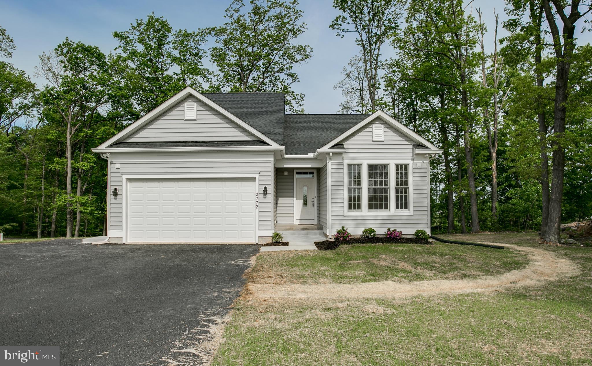 3772 Hooper Road New Windsor, MD 21776 - Photo 1 of 30 a front view of a house with a yard and garage