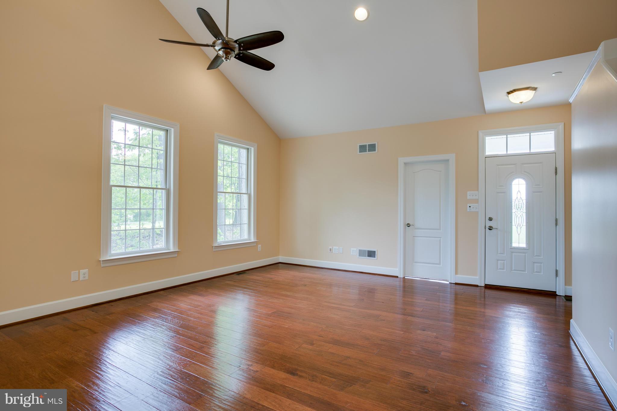 3772 Hooper Road New Windsor, MD 21776 - Photo 14 of 30 a view of an empty room with wooden floor and a window