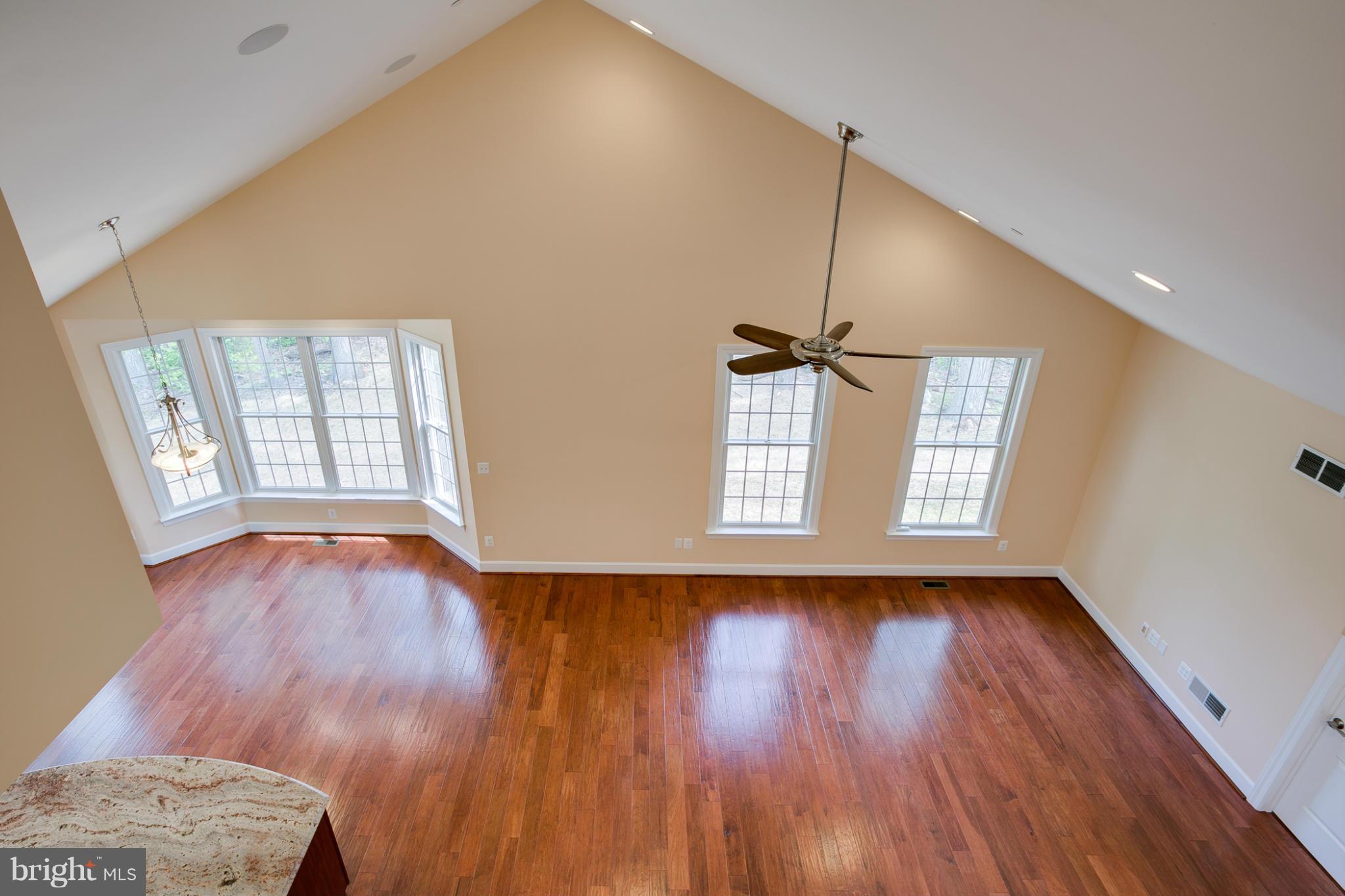 3772 Hooper Road New Windsor, MD 21776 - Photo 16 of 30 a view of an empty room with wooden floor and a window