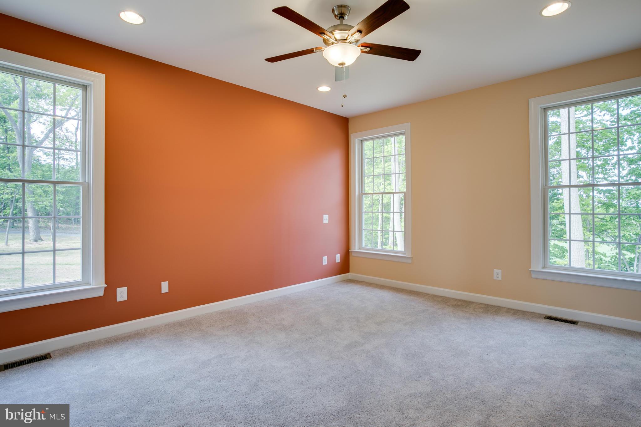 3772 Hooper Road New Windsor, MD 21776 - Photo 18 of 30 an empty room with windows and fan