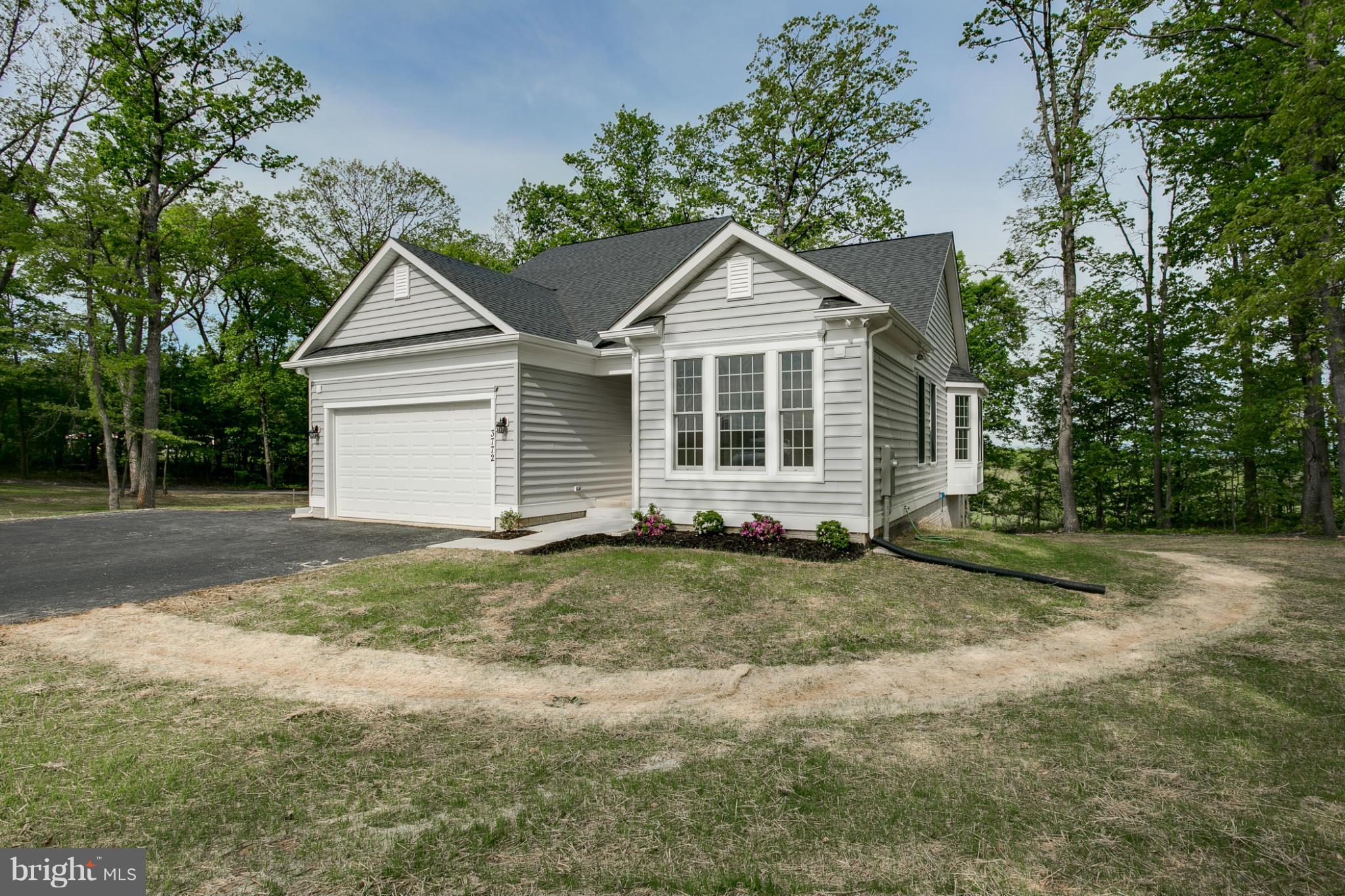 3772 Hooper Road New Windsor, MD 21776 - Photo 3 of 30 a view of a yard in front of a house with large trees