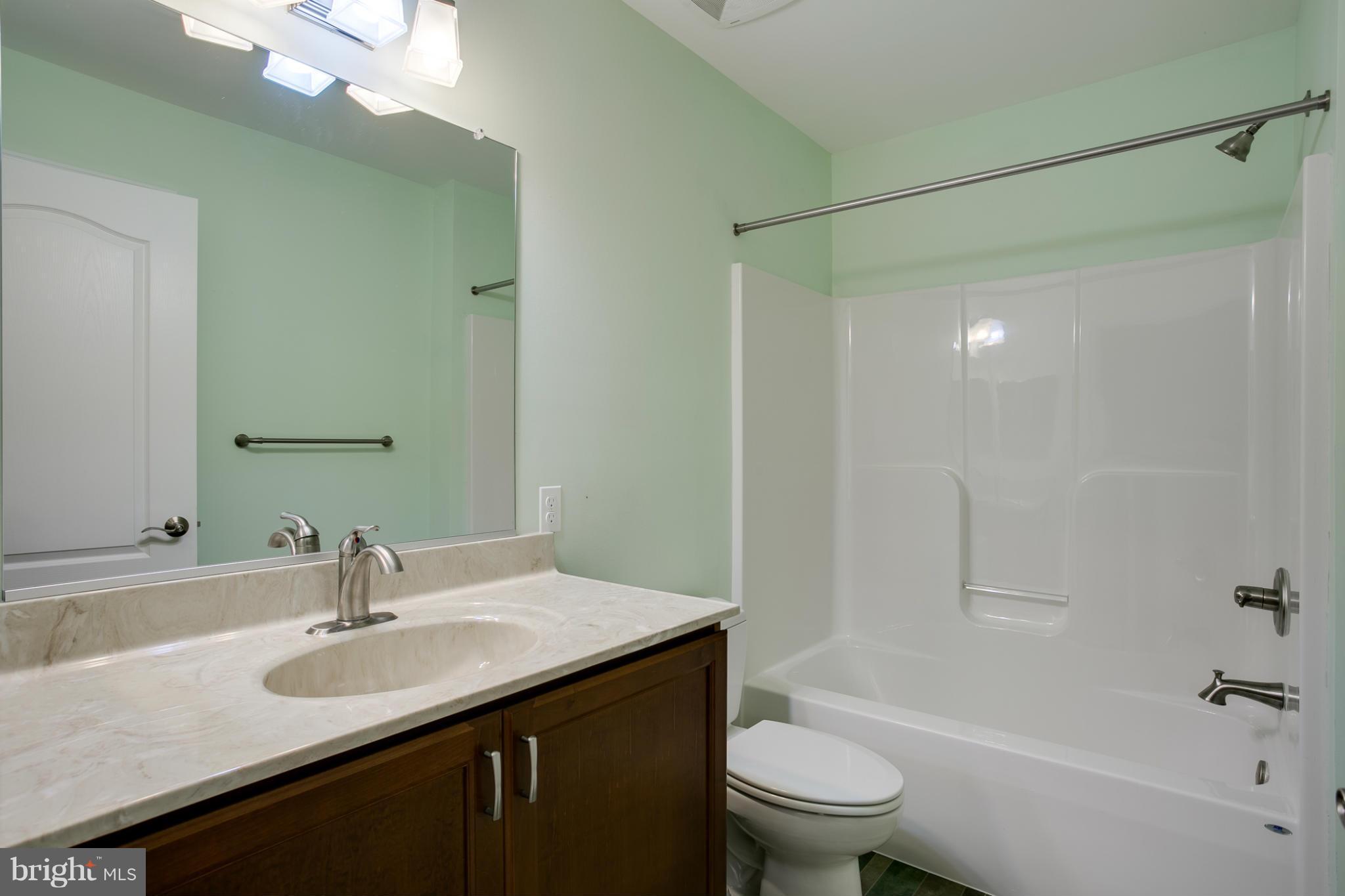 3772 Hooper Road New Windsor, MD 21776 - Photo 22 of 30 a bathroom with a sink and a mirror