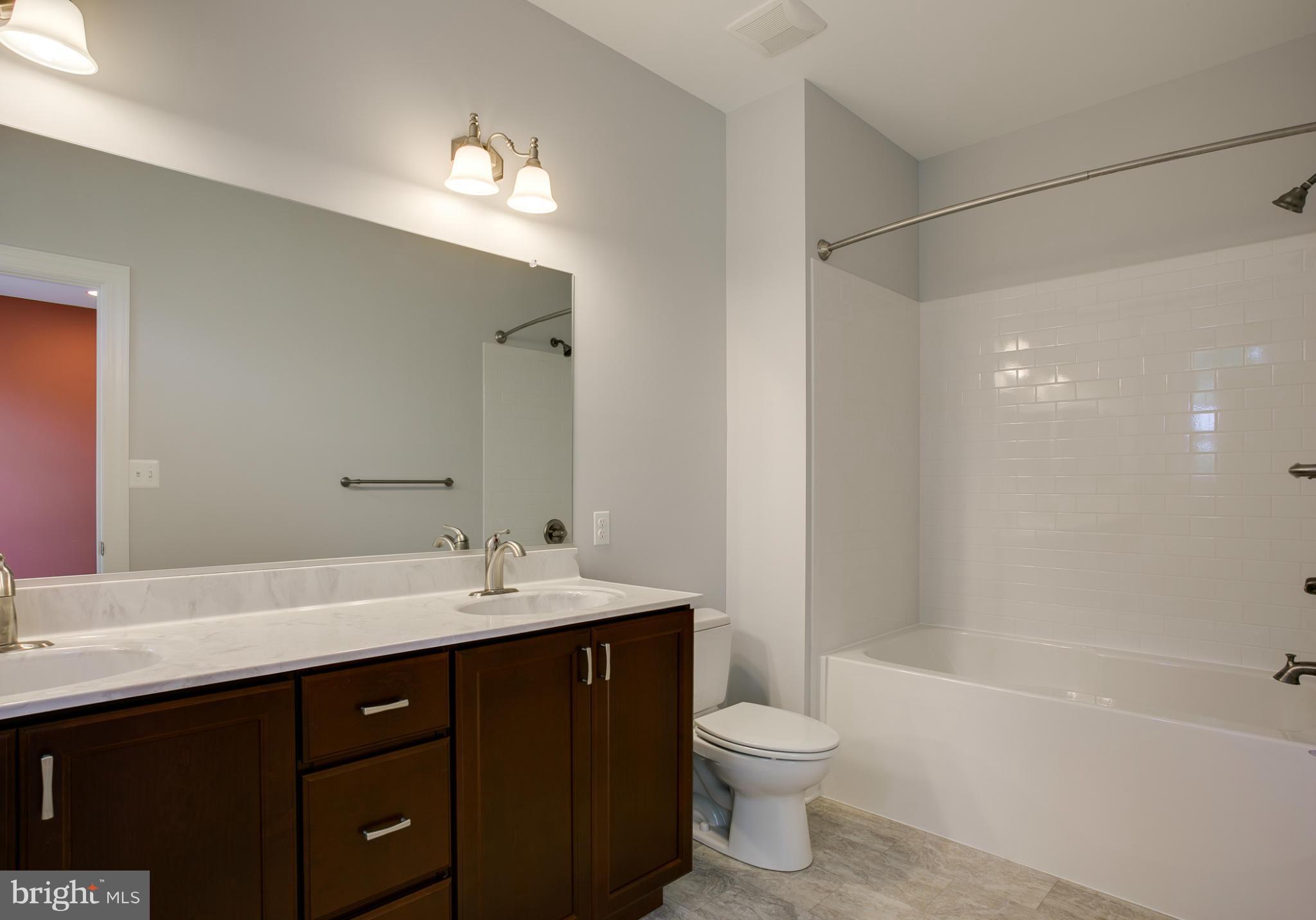 3772 Hooper Road New Windsor, MD 21776 - Photo 23 of 30 a bathroom with a sink a toilet and shower