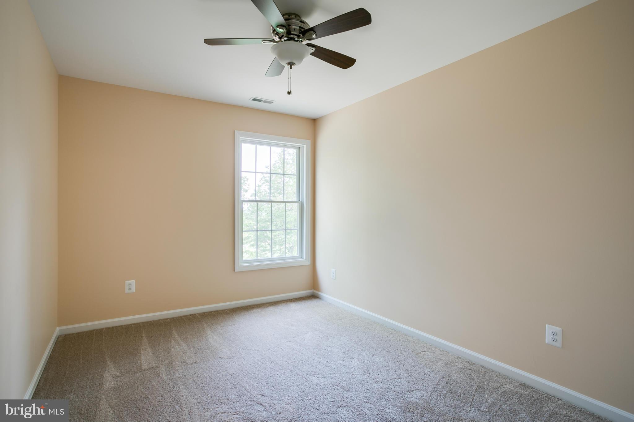 3772 Hooper Road New Windsor, MD 21776 - Photo 26 of 30 an empty room with windows and fan