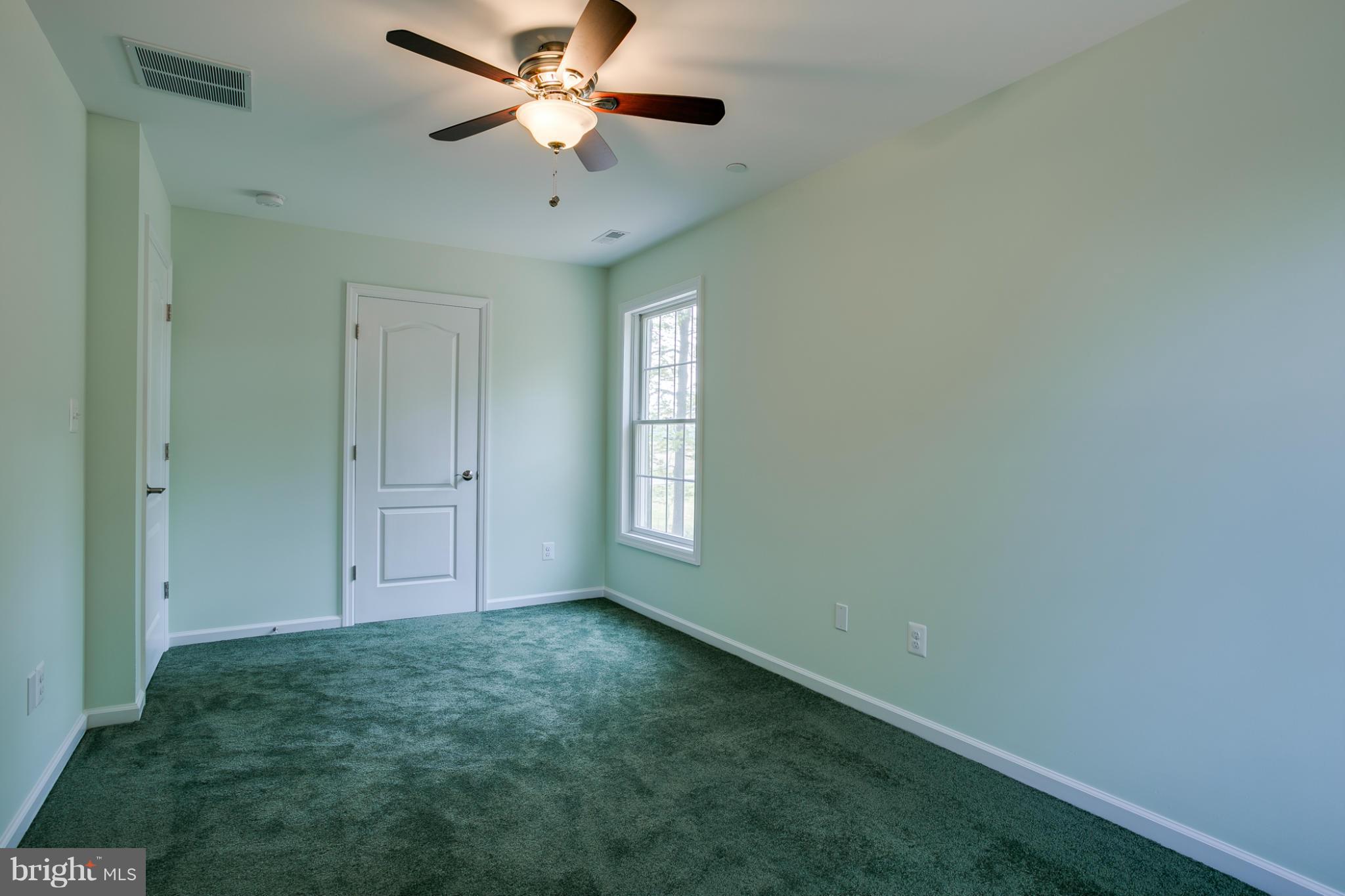 3772 Hooper Road New Windsor, MD 21776 - Photo 27 of 30 an empty room with windows and fan