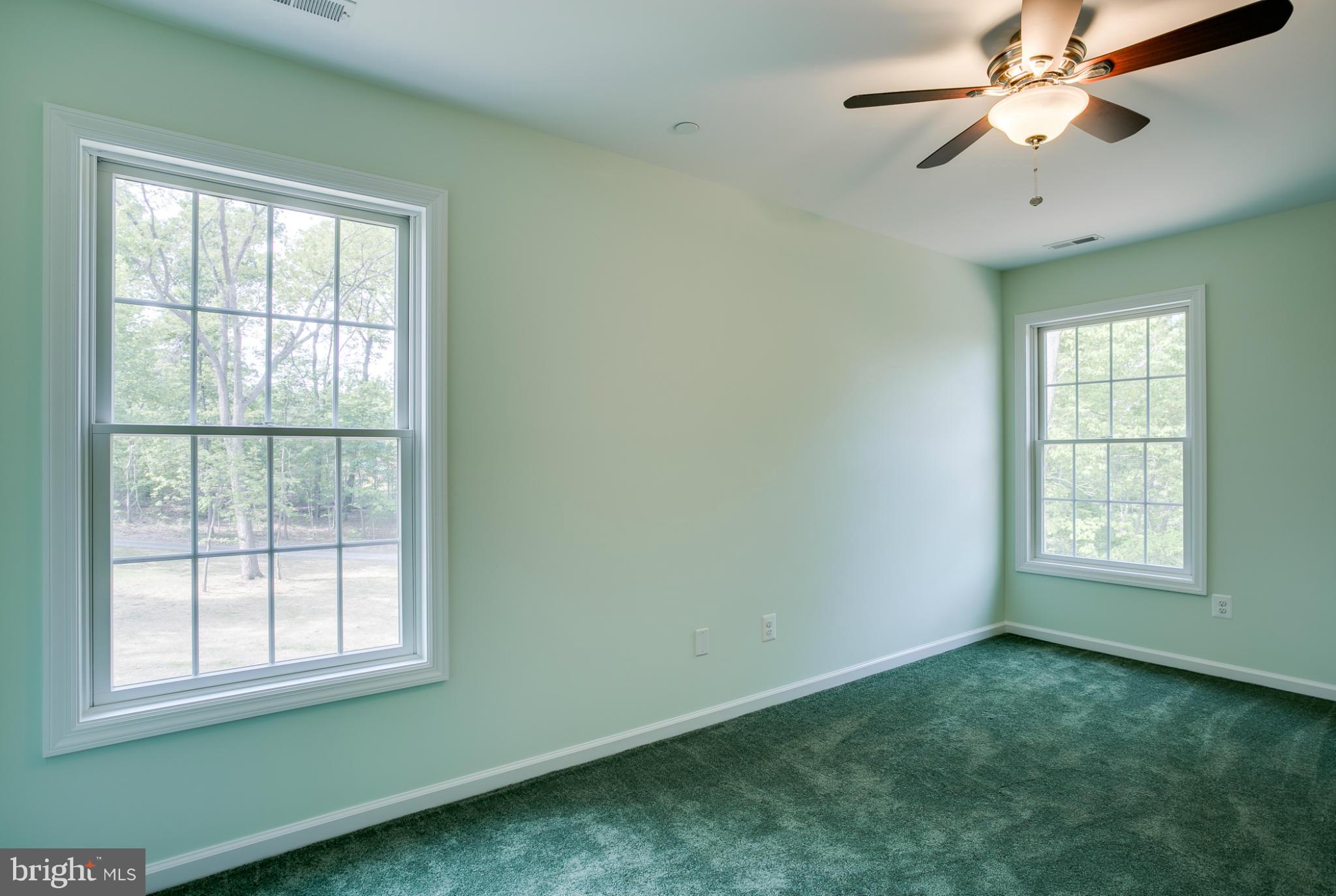 3772 Hooper Road New Windsor, MD 21776 - Photo 28 of 30 an empty room with a window and a fan