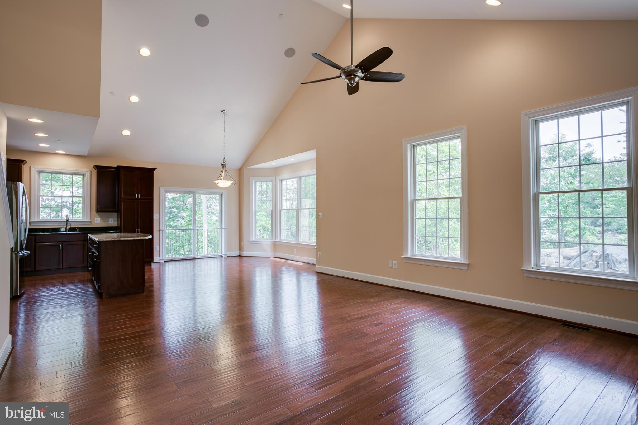 3772 Hooper Road New Windsor, MD 21776 - Photo 6 of 30 a view of an empty room with wooden floor and a window