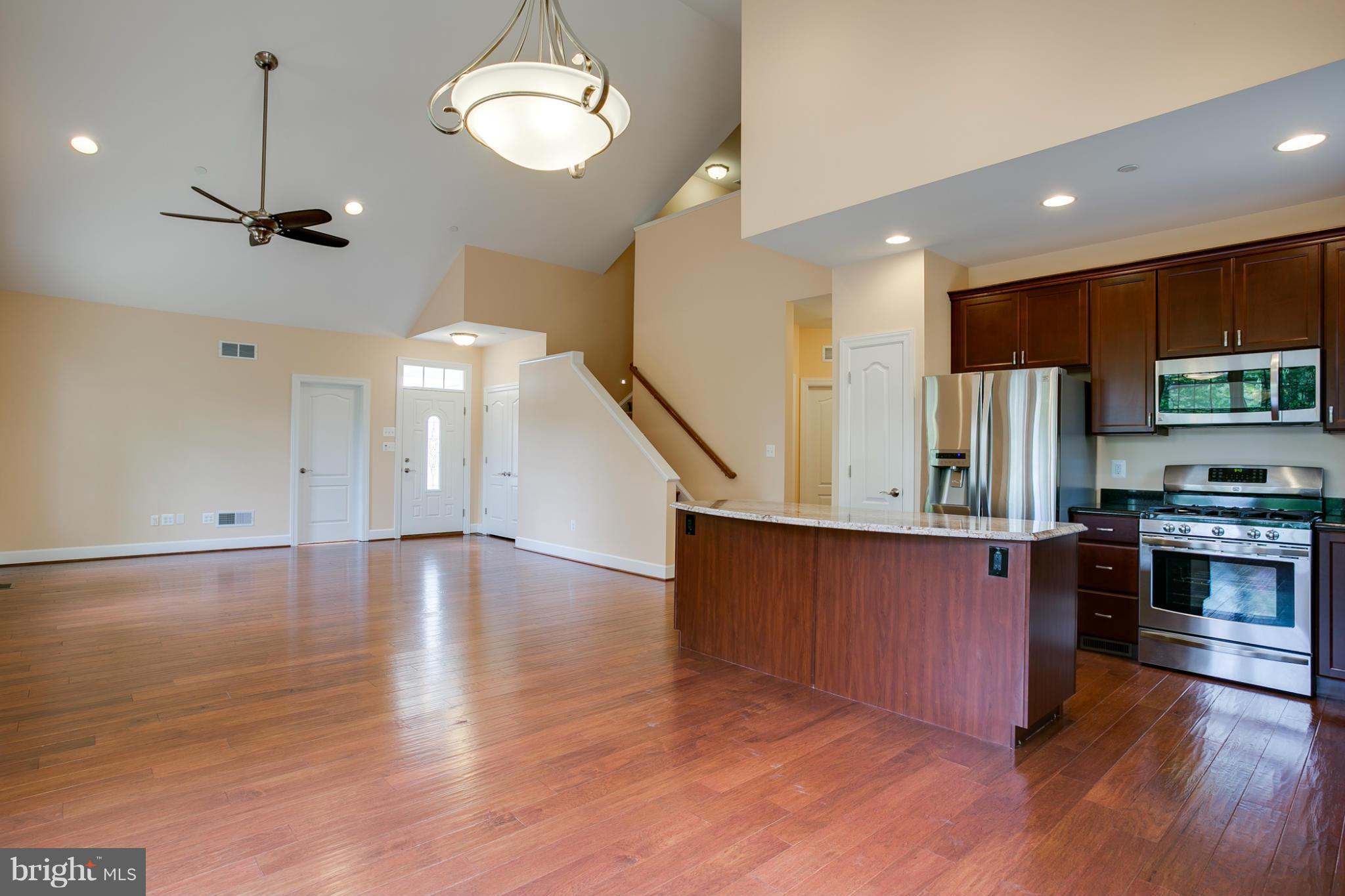 3772 Hooper Road New Windsor, MD 21776 - Photo 10 of 30 a view of a kitchen with cabinets and wooden floor