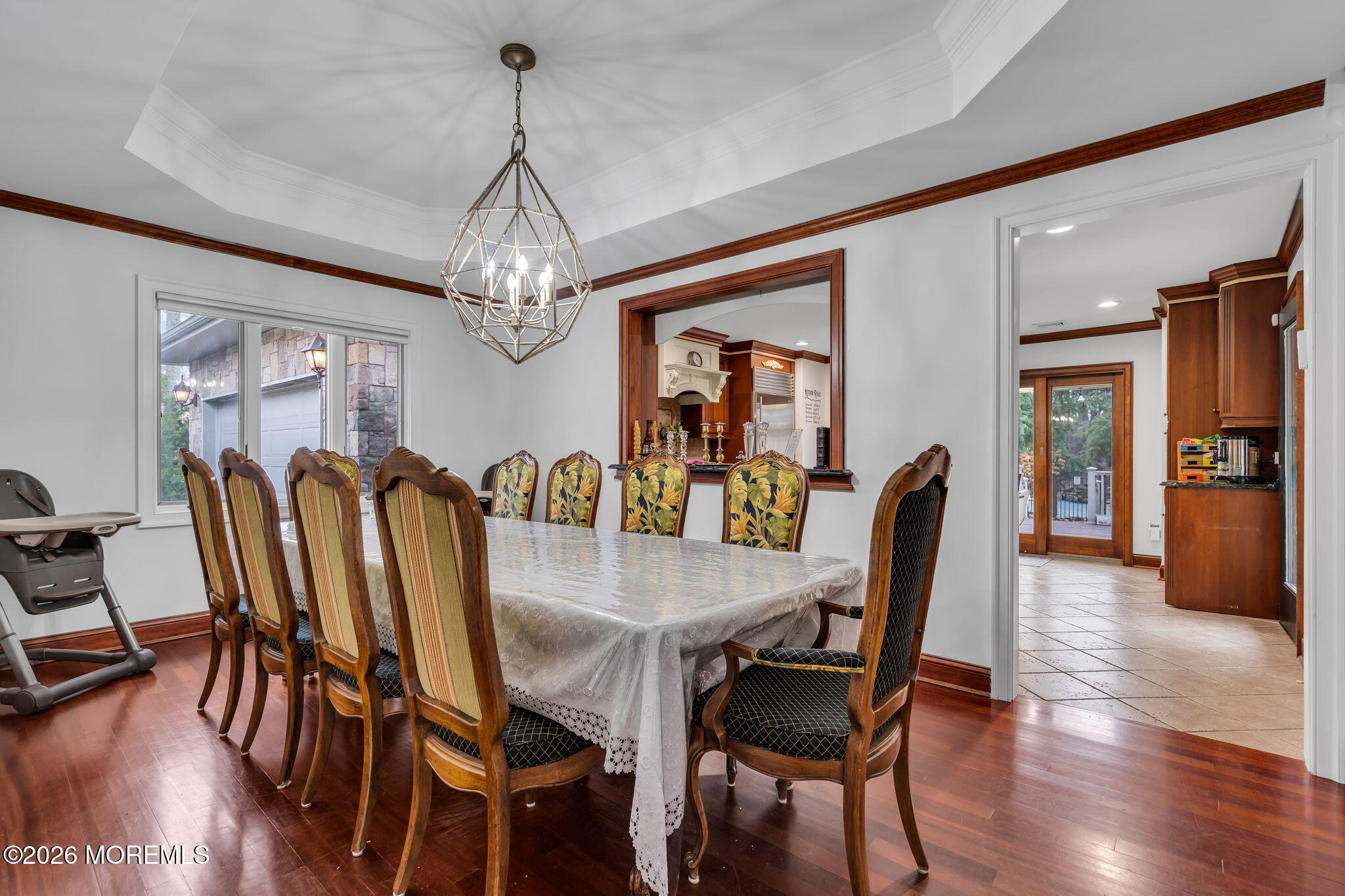 1731 Silverton Road Toms River, NJ 08753 - Photo 13 of 46 a view of a dining room with furniture a chandelier and wooden floor
