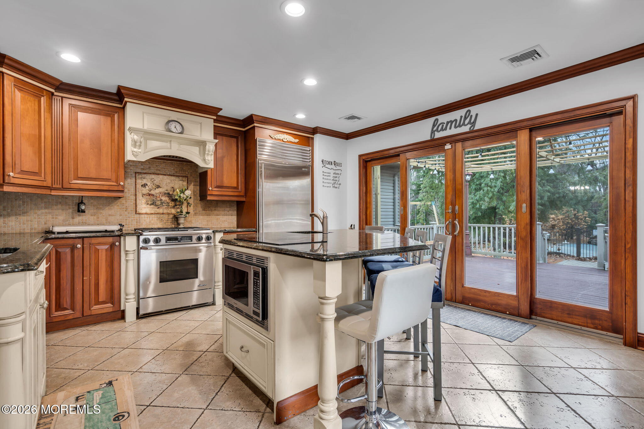 1731 Silverton Road Toms River, NJ 08753 - Photo 14 of 46 a kitchen with stainless steel appliances granite countertop a stove top oven microwave and a dining table