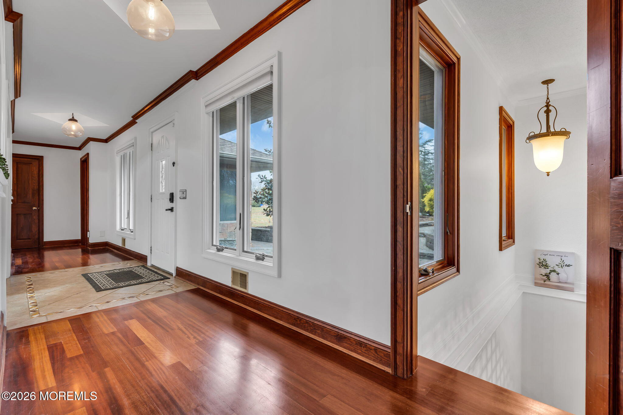 1731 Silverton Road Toms River, NJ 08753 - Photo 19 of 46 a view of a hallway with wooden floor and a bathroom