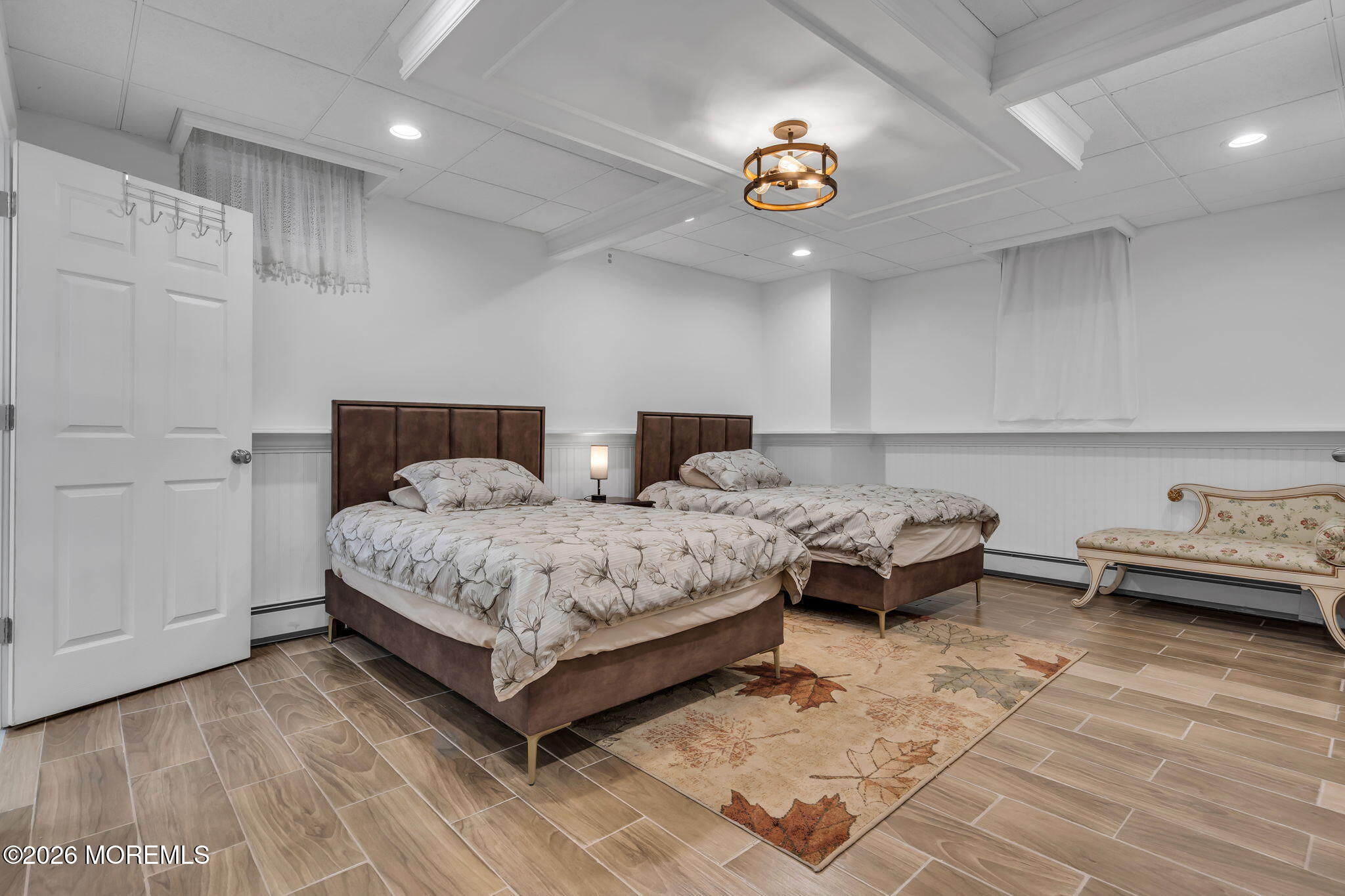 1731 Silverton Road Toms River, NJ 08753 - Photo 29 of 46 a bedroom with a bed and a chandelier