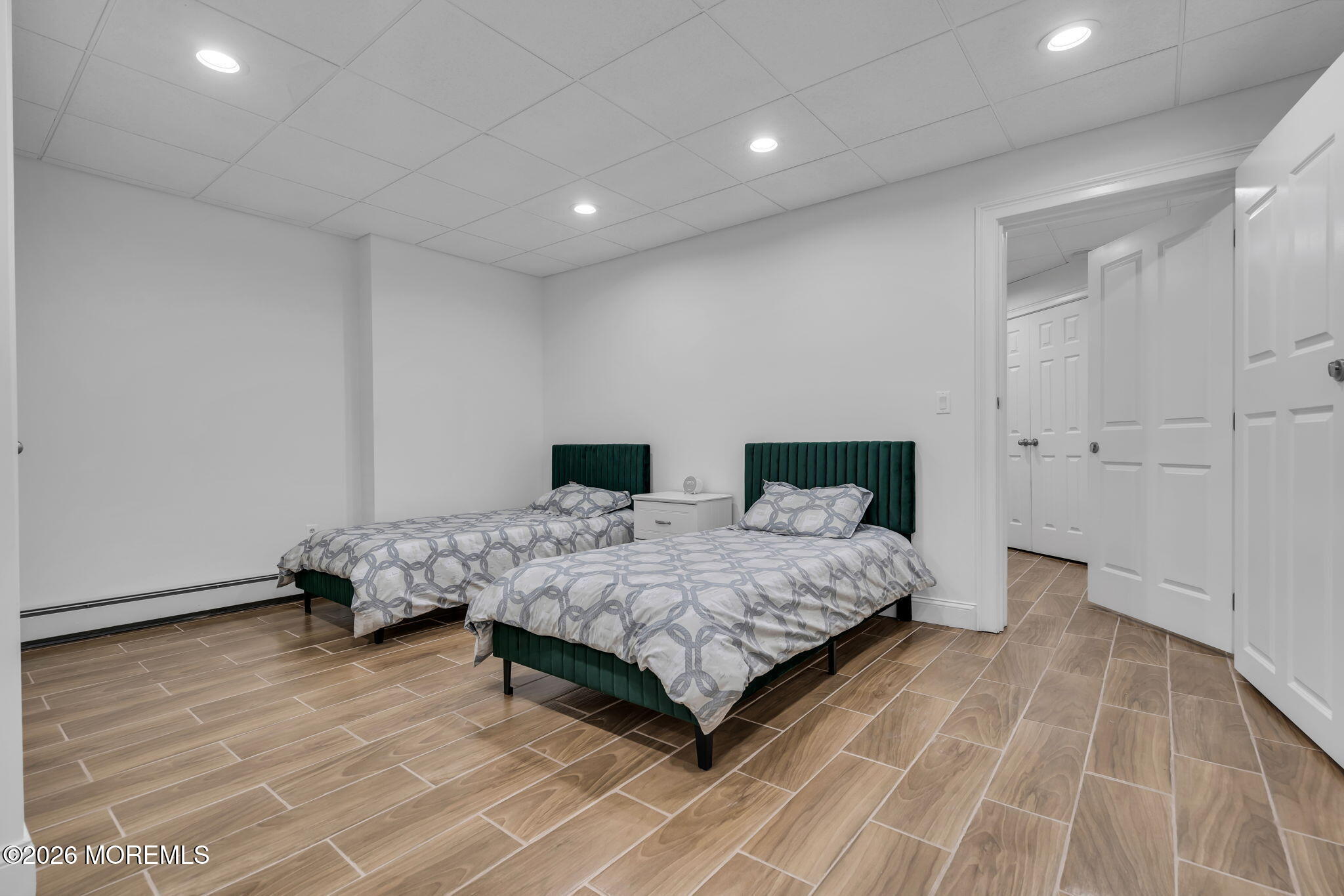 1731 Silverton Road Toms River, NJ 08753 - Photo 31 of 46 a bedroom with a bed and wooden floor