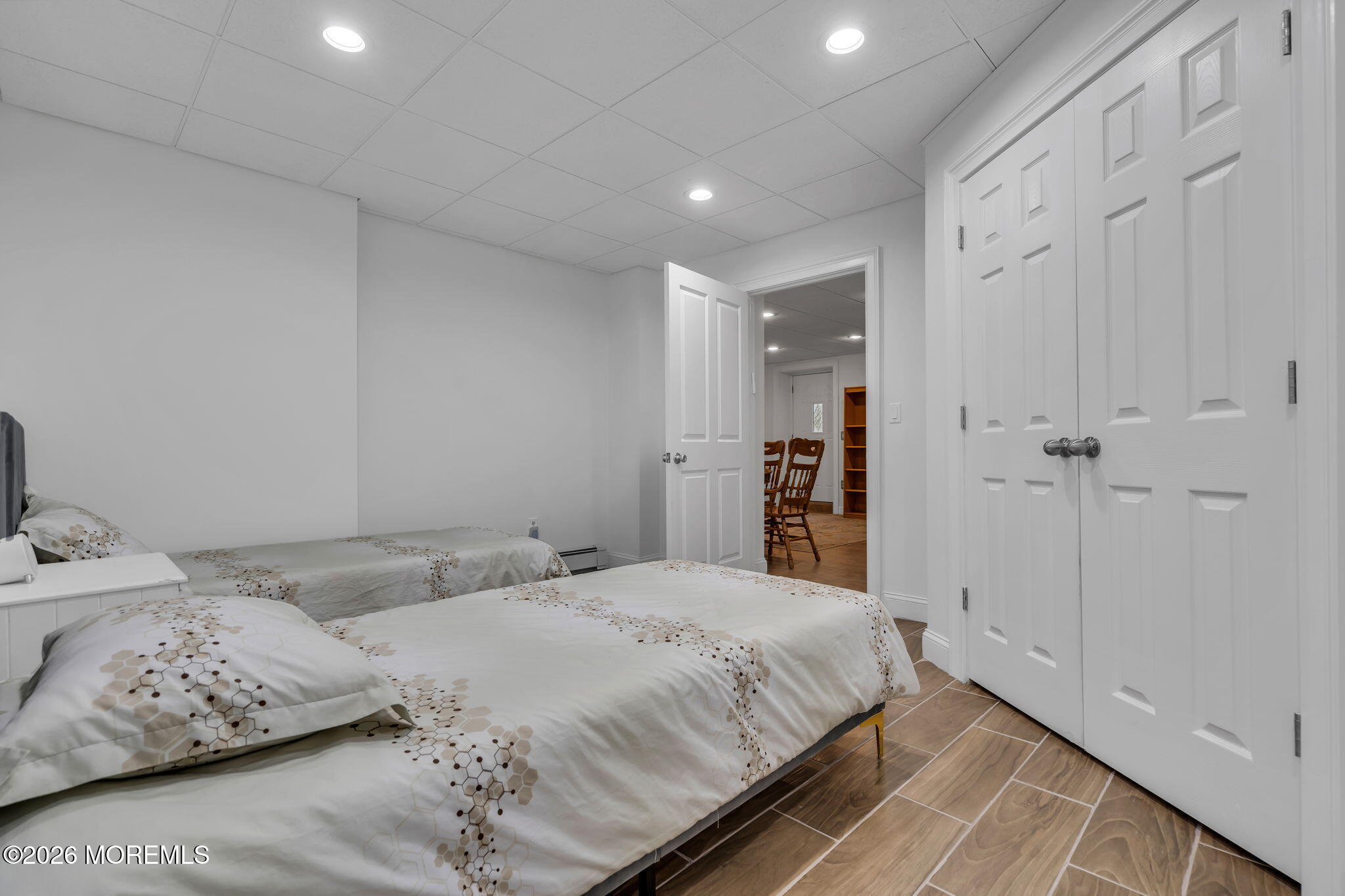 1731 Silverton Road Toms River, NJ 08753 - Photo 33 of 46 a bedroom with a large bed and a chandelier