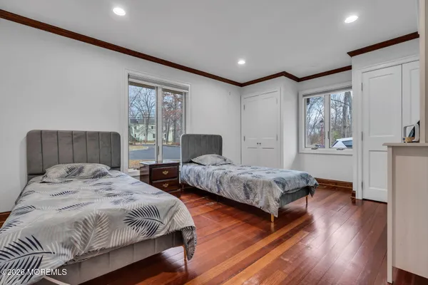 a kitchen with stainless steel appliances granite countertop a stove top oven microwave and a dining table