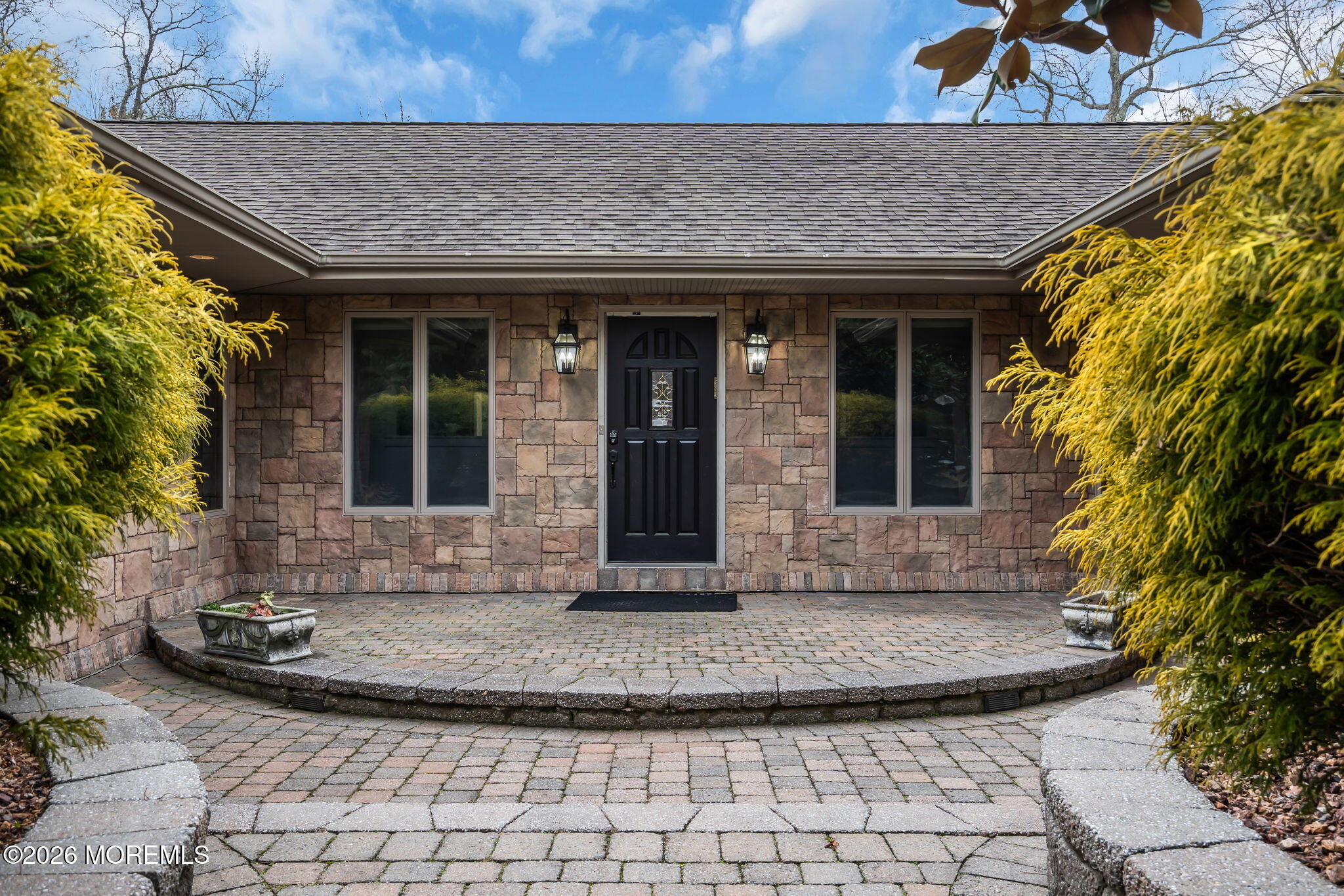 1731 Silverton Road Toms River, NJ 08753 - Photo 10 of 46 a view of a brick house with potted plants