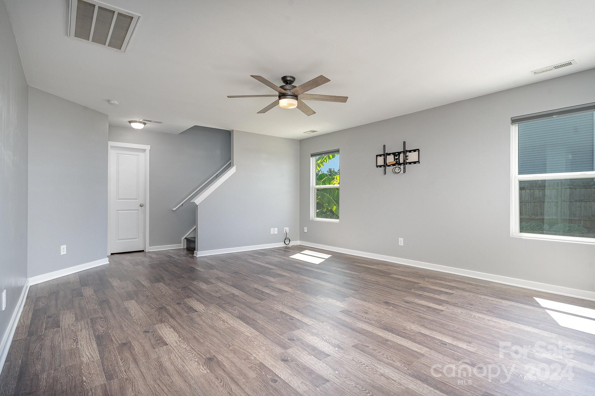 4602 Gibbons Link Road Charlotte, NC 28269 - Photo 13 of 35 wooden floor in an empty room with a window
