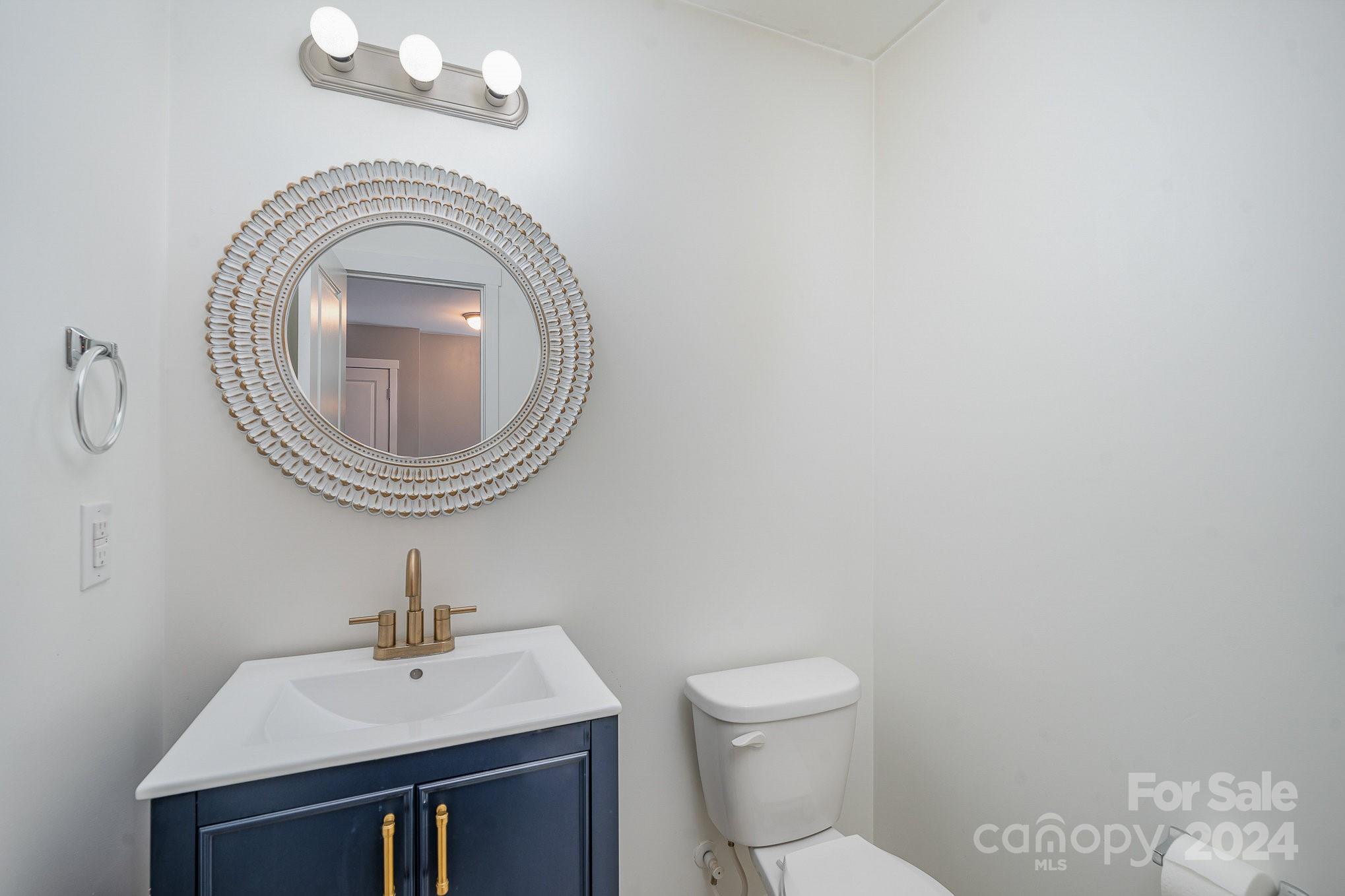 4602 Gibbons Link Road Charlotte, NC 28269 - Photo 15 of 35 a bathroom with a sink and a toilet