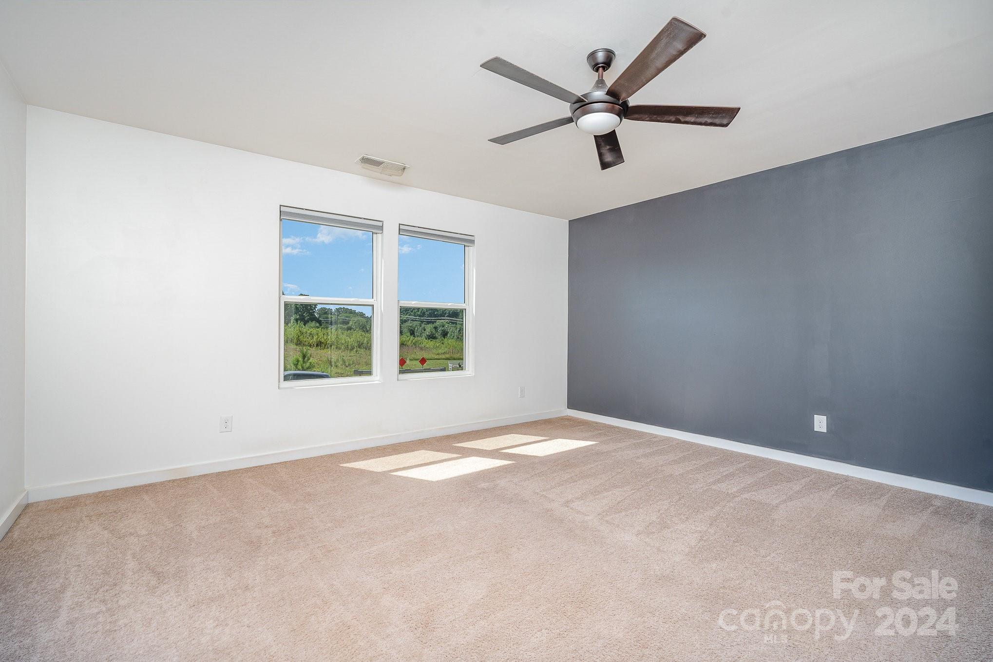 4602 Gibbons Link Road Charlotte, NC 28269 - Photo 18 of 35 an empty room with a window