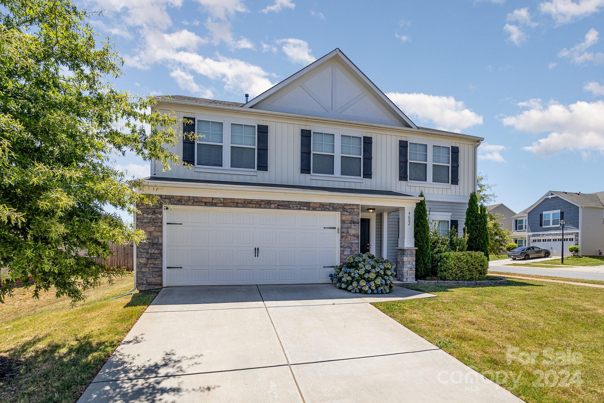 4602 Gibbons Link Road Charlotte, NC 28269 - Photo 2 of 35 a house view with a garden space