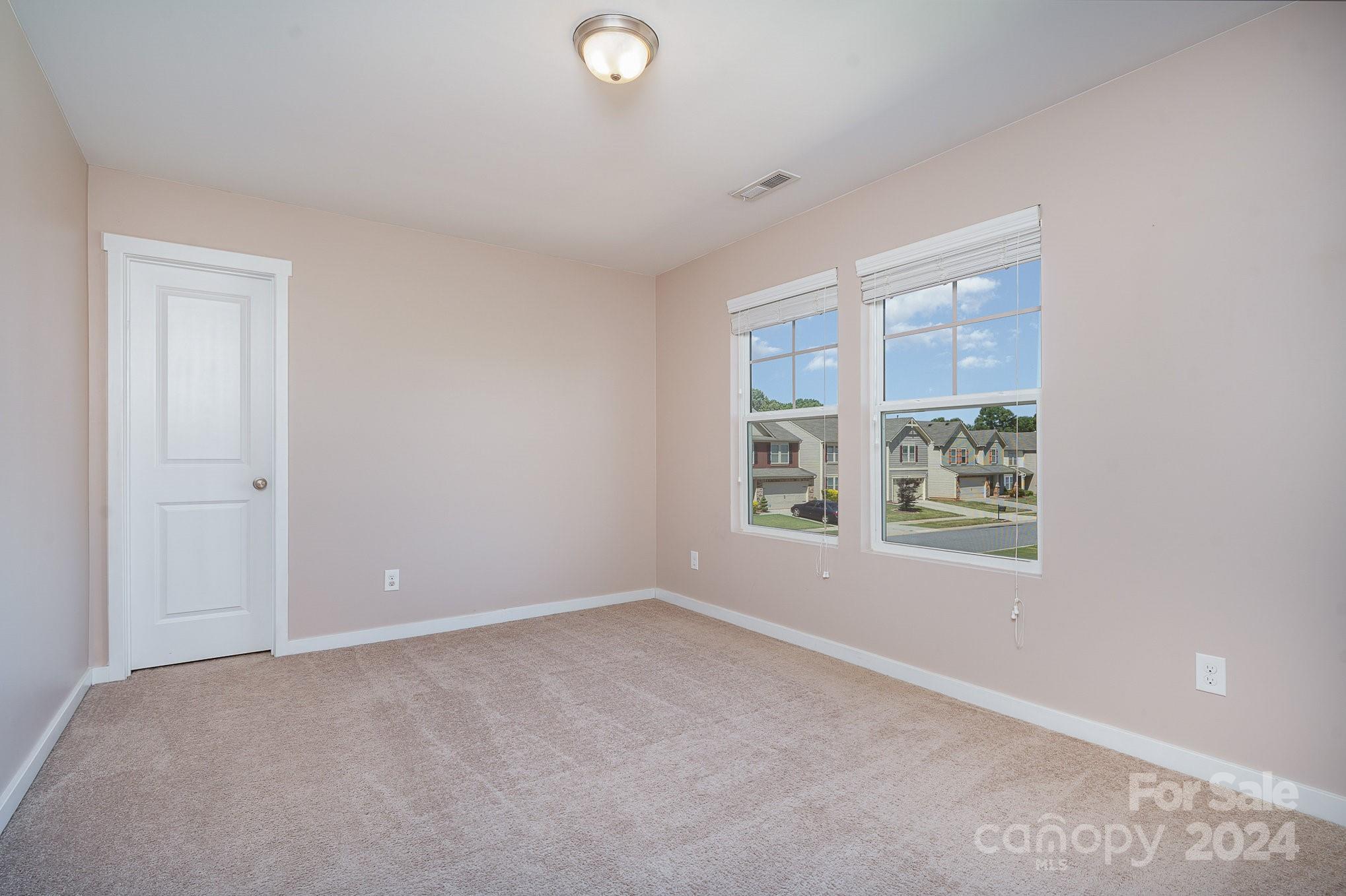 4602 Gibbons Link Road Charlotte, NC 28269 - Photo 23 of 35 a view of an empty room with a window