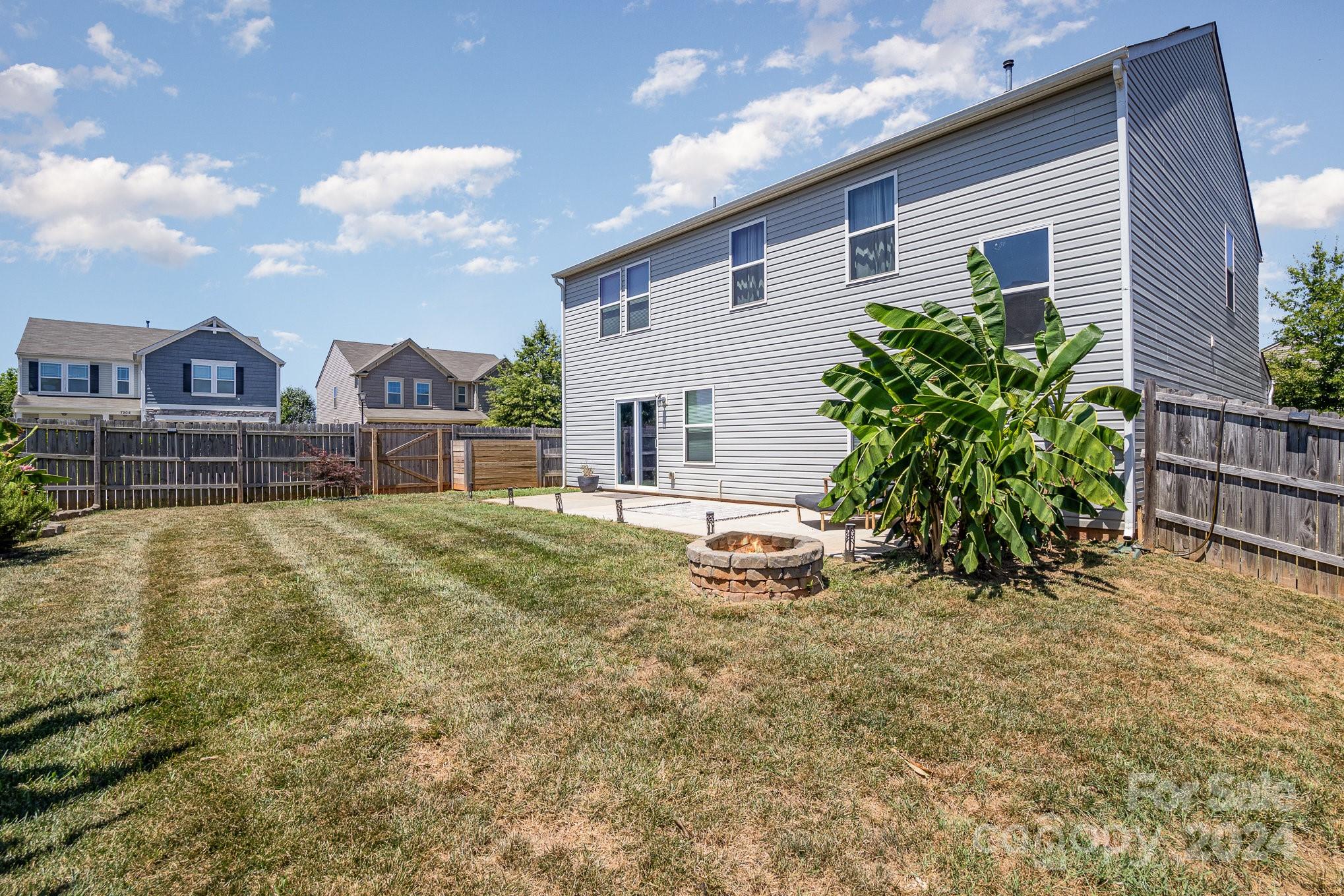 4602 Gibbons Link Road Charlotte, NC 28269 - Photo 31 of 35 a view of a house with a yard