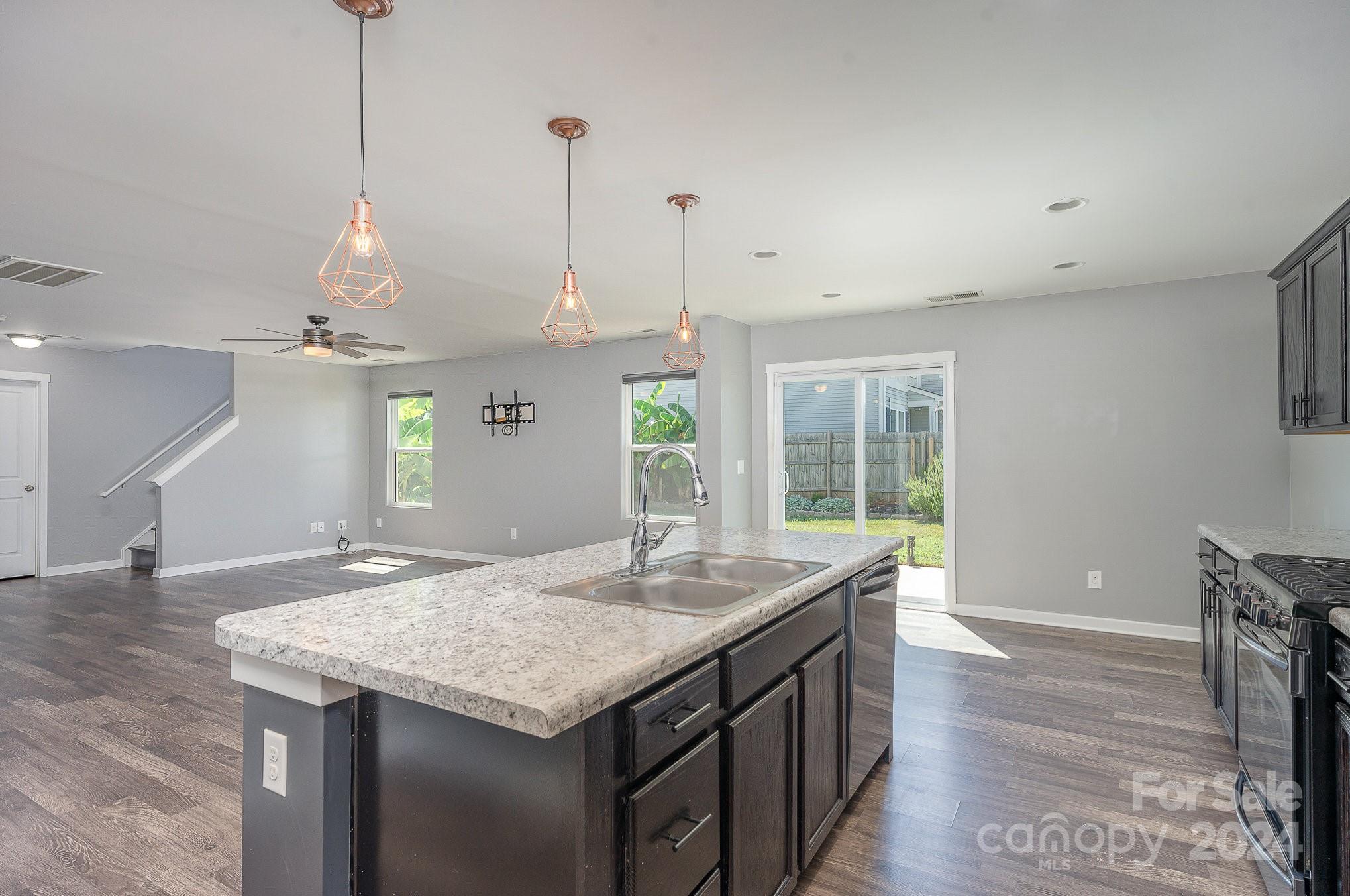 4602 Gibbons Link Road Charlotte, NC 28269 - Photo 7 of 35 a kitchen with a table and chairs in it