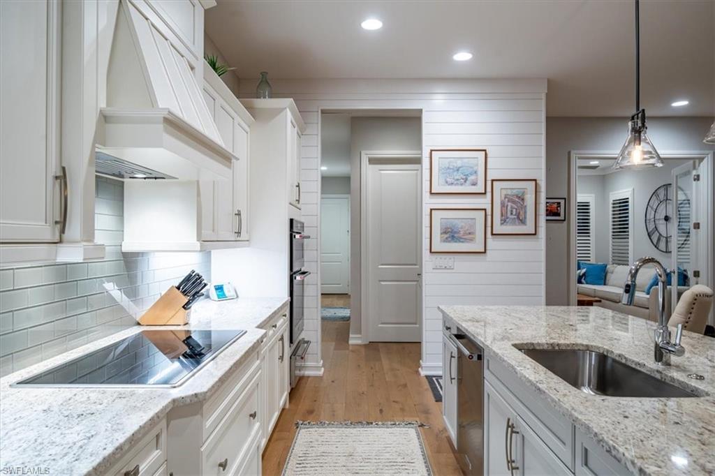 14372 Neptune Avenue Naples, FL 34114 - Photo 20 of 49 Glass tiled backsplash