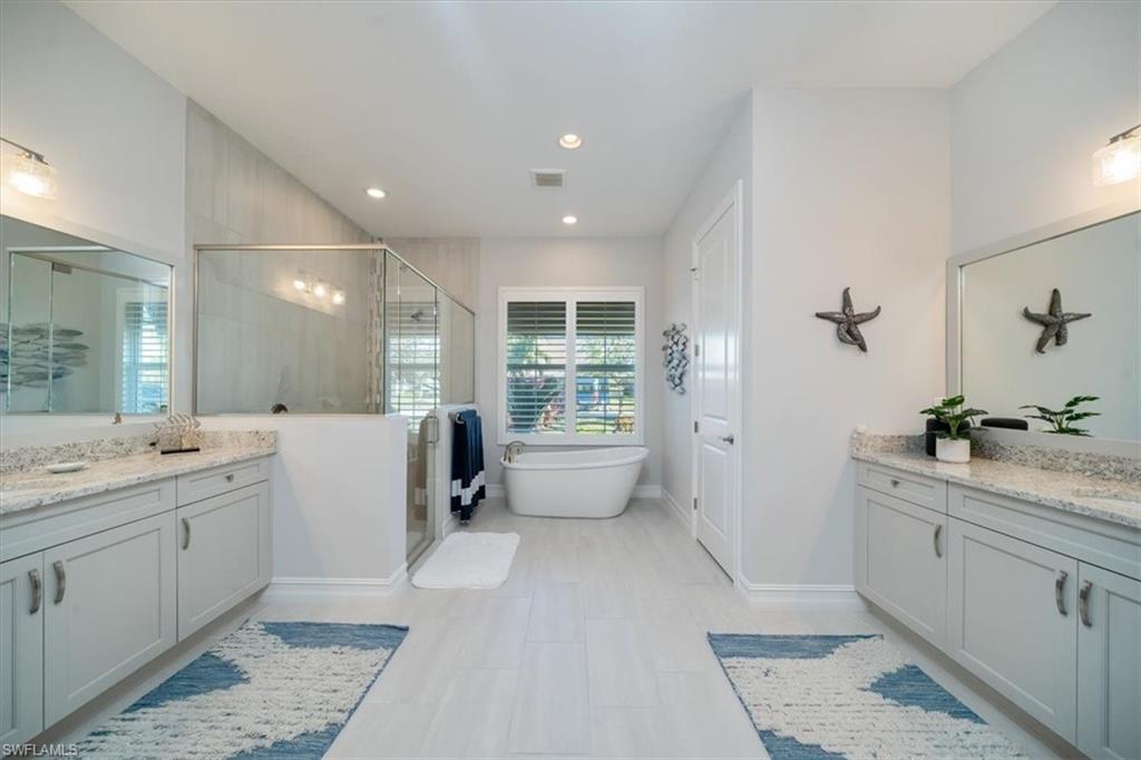 14372 Neptune Avenue Naples, FL 34114 - Photo 28 of 49 Owner's bath 2 vanities