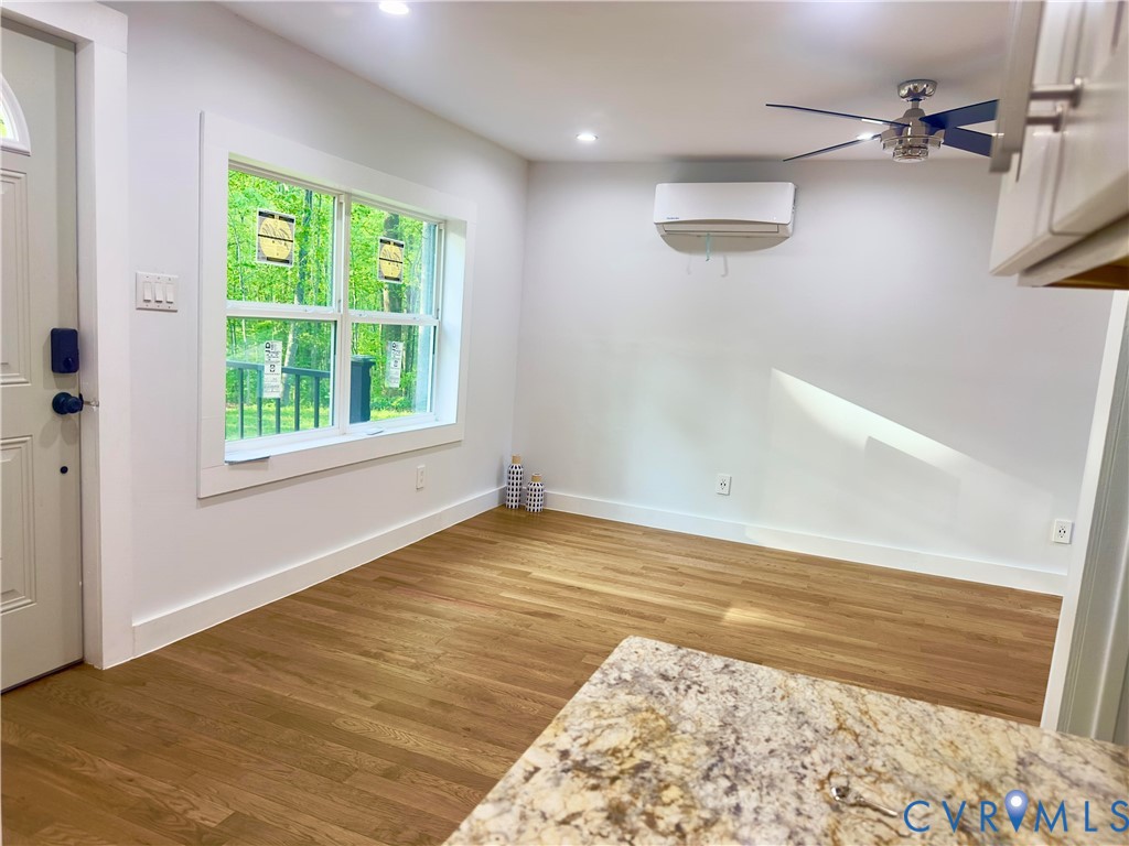 3829 Five Forks Road Pamplin, VA 23958 - Photo 32 of 65 a view of an empty room with wooden floor and a window