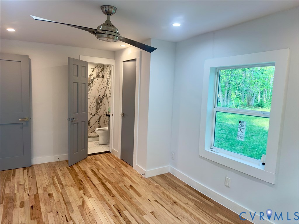 3829 Five Forks Road Pamplin, VA 23958 - Photo 34 of 65 a view of empty room with wooden floor and fan